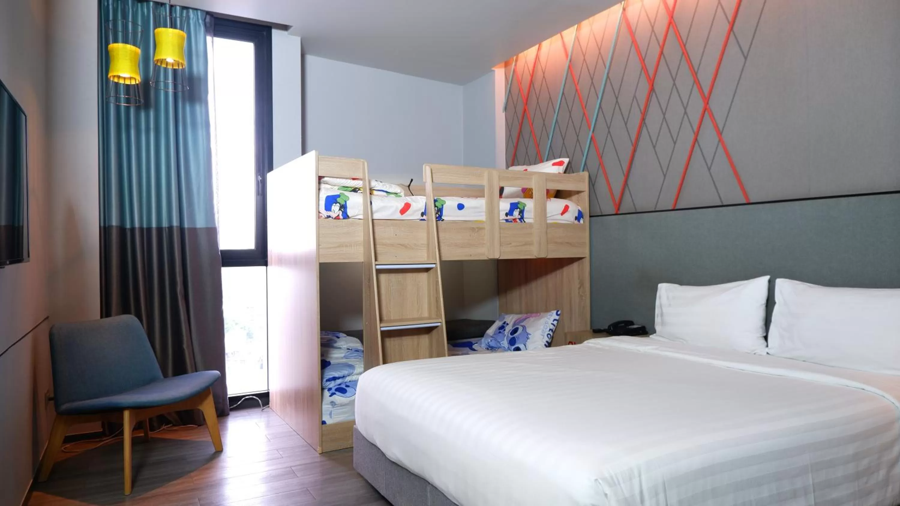 Family Room with One King Bed and One Bunk Bed in ibis Styles Bangkok Sukhumvit Phra Khanong