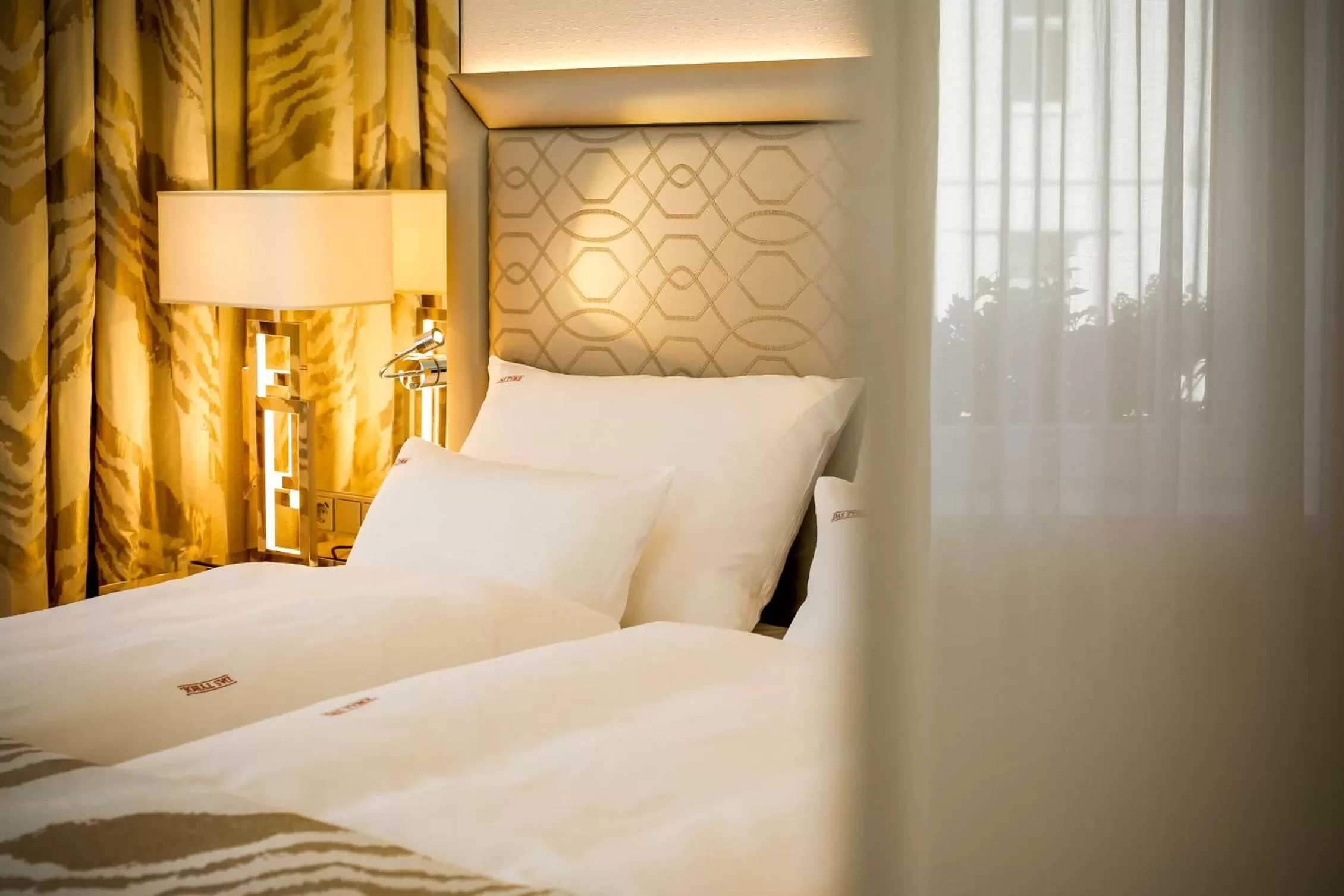 Bed in Boutiquehotel Das Tyrol