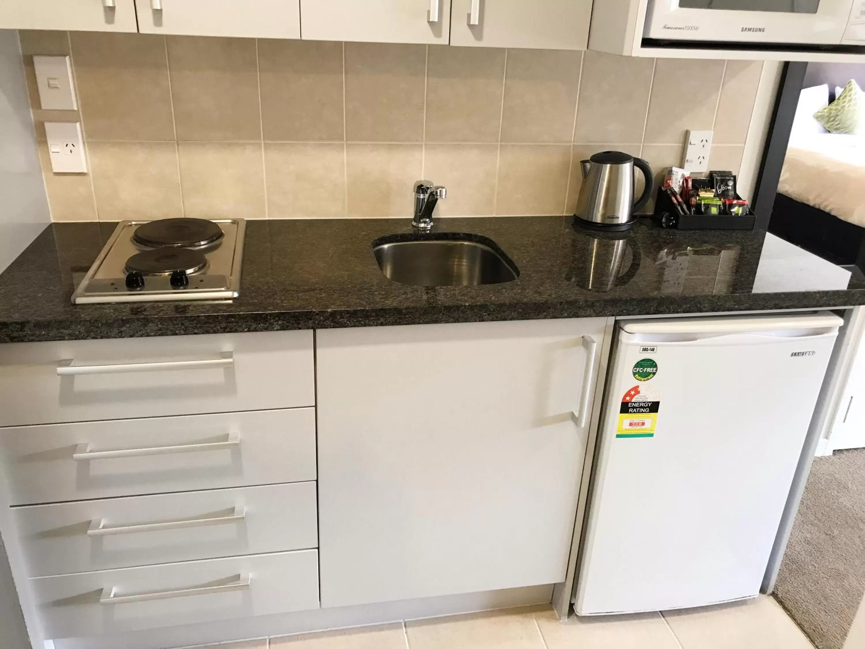 Kitchen or kitchenette in Alpha Motel with Spa-Bath