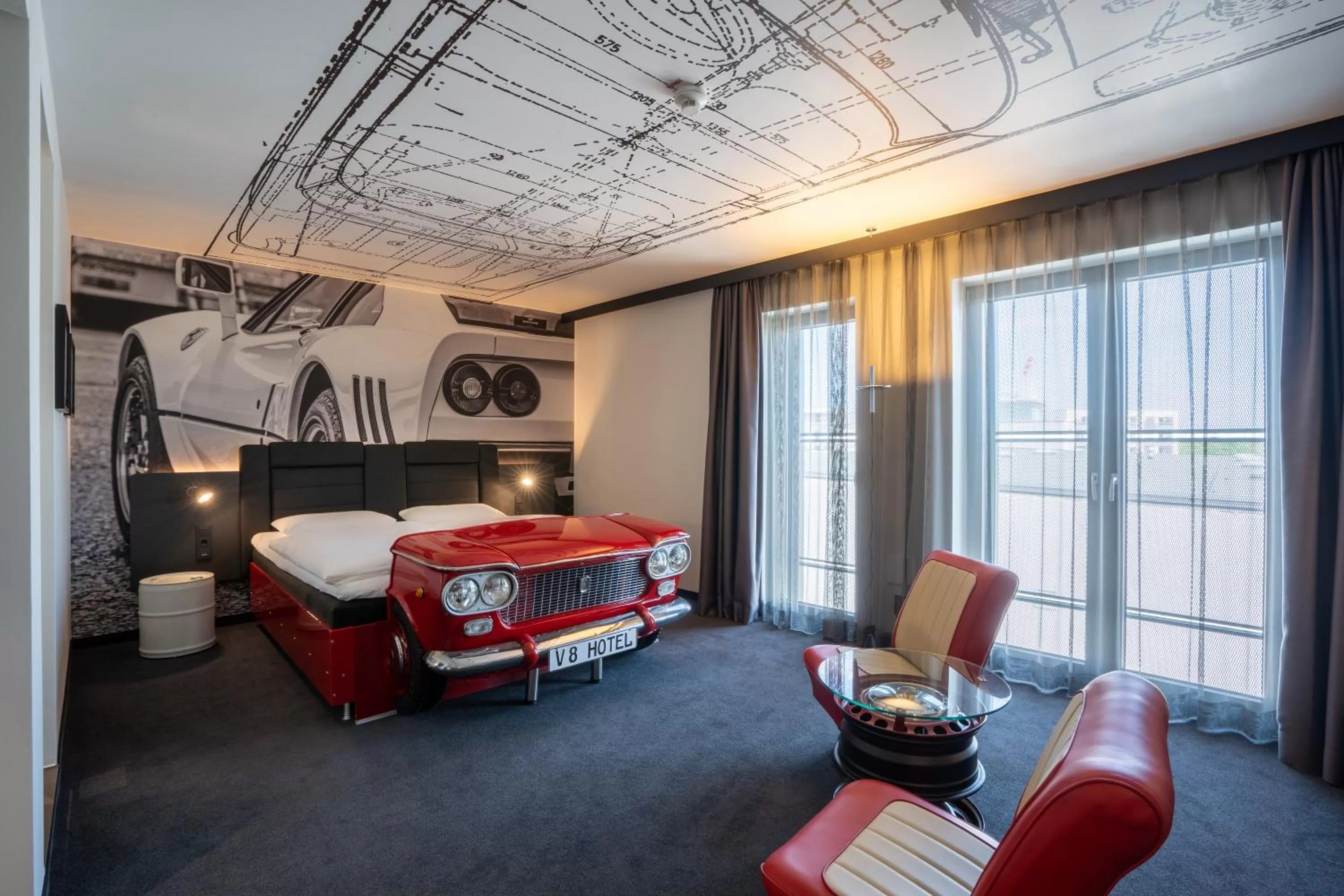 Photo of the whole room, Bed in V8 Hotel Köln at MOTORWORLD
