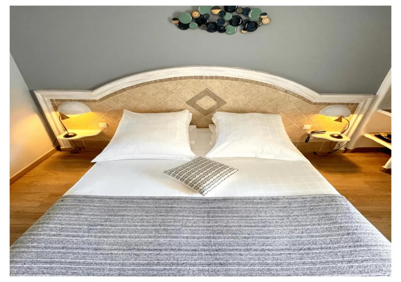 Bed in Ostella Spa & Resort