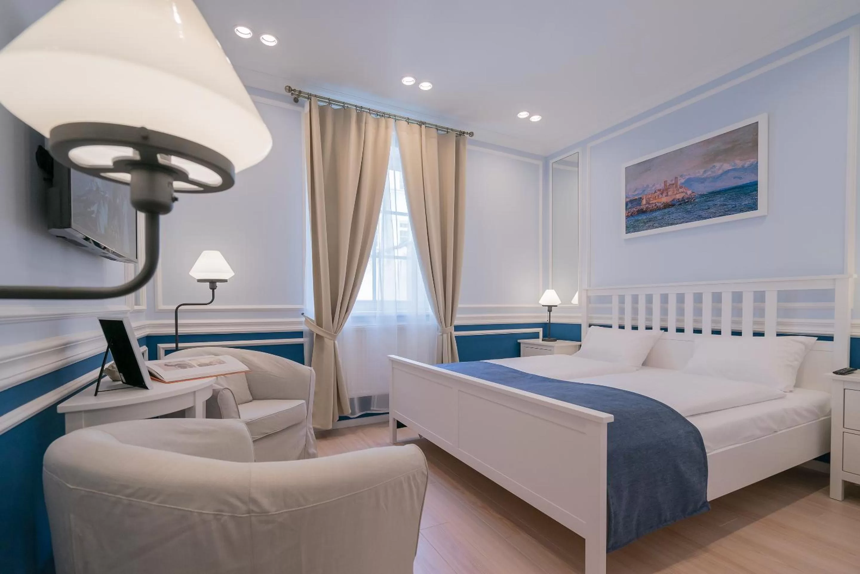 Seating area, Bed in Revelton Suites Karlovy Vary