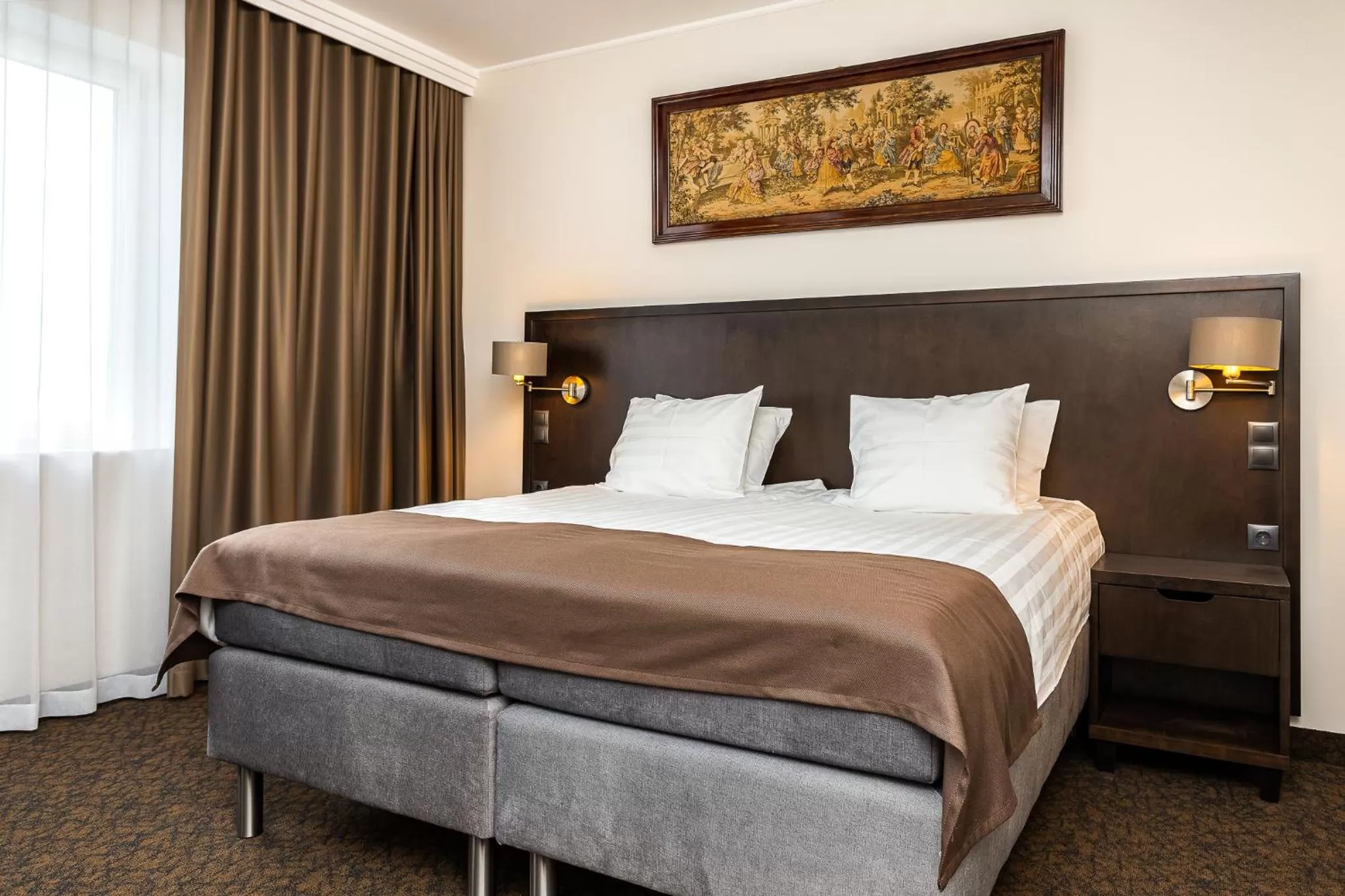 Bed in Adoryal Hotell