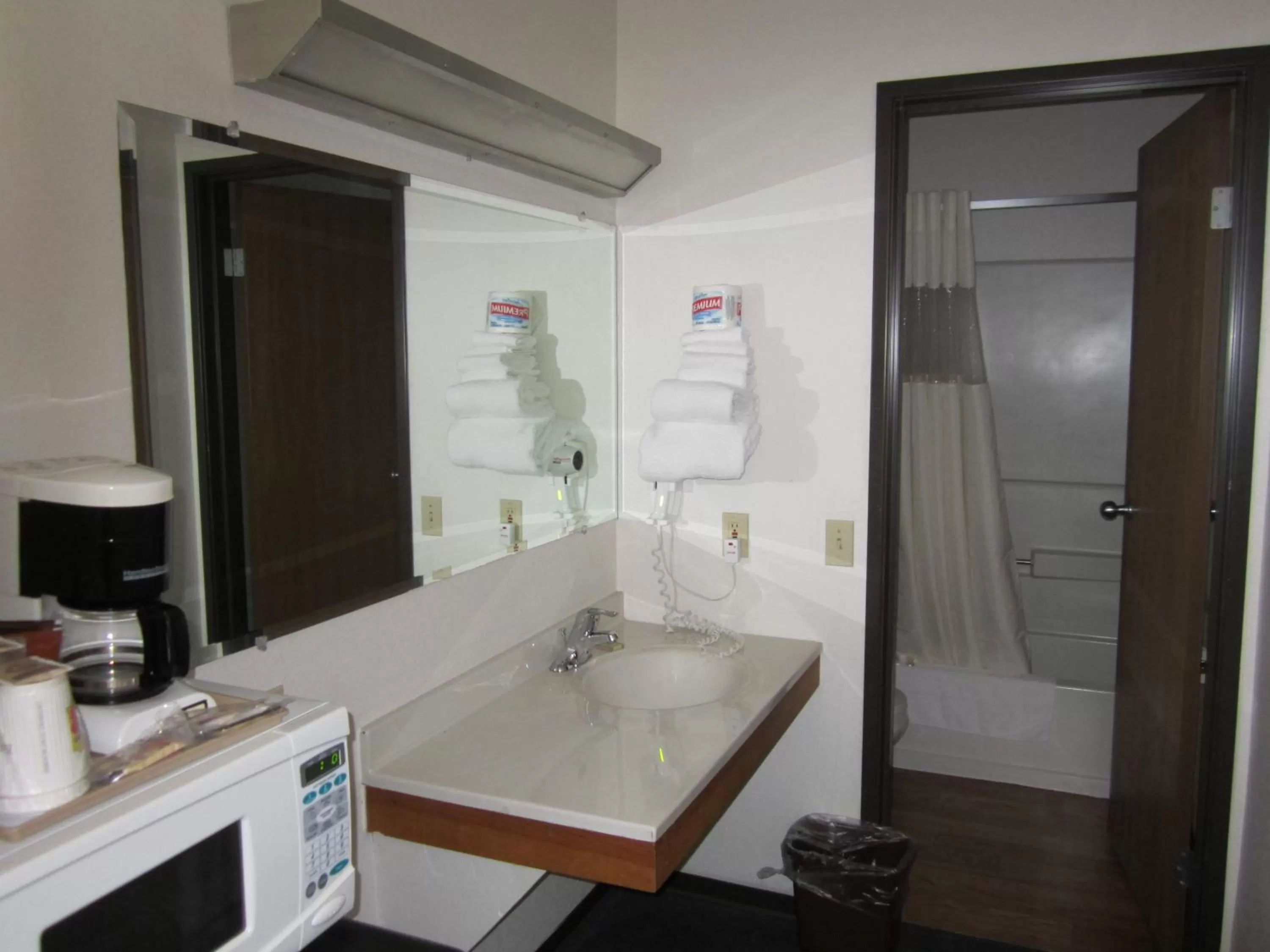 Bathroom, Bed in Super 8 by Wyndham Williams Lake BC