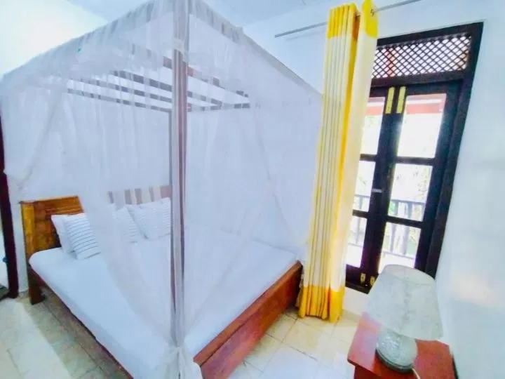 Bed in Kadolana Guest House