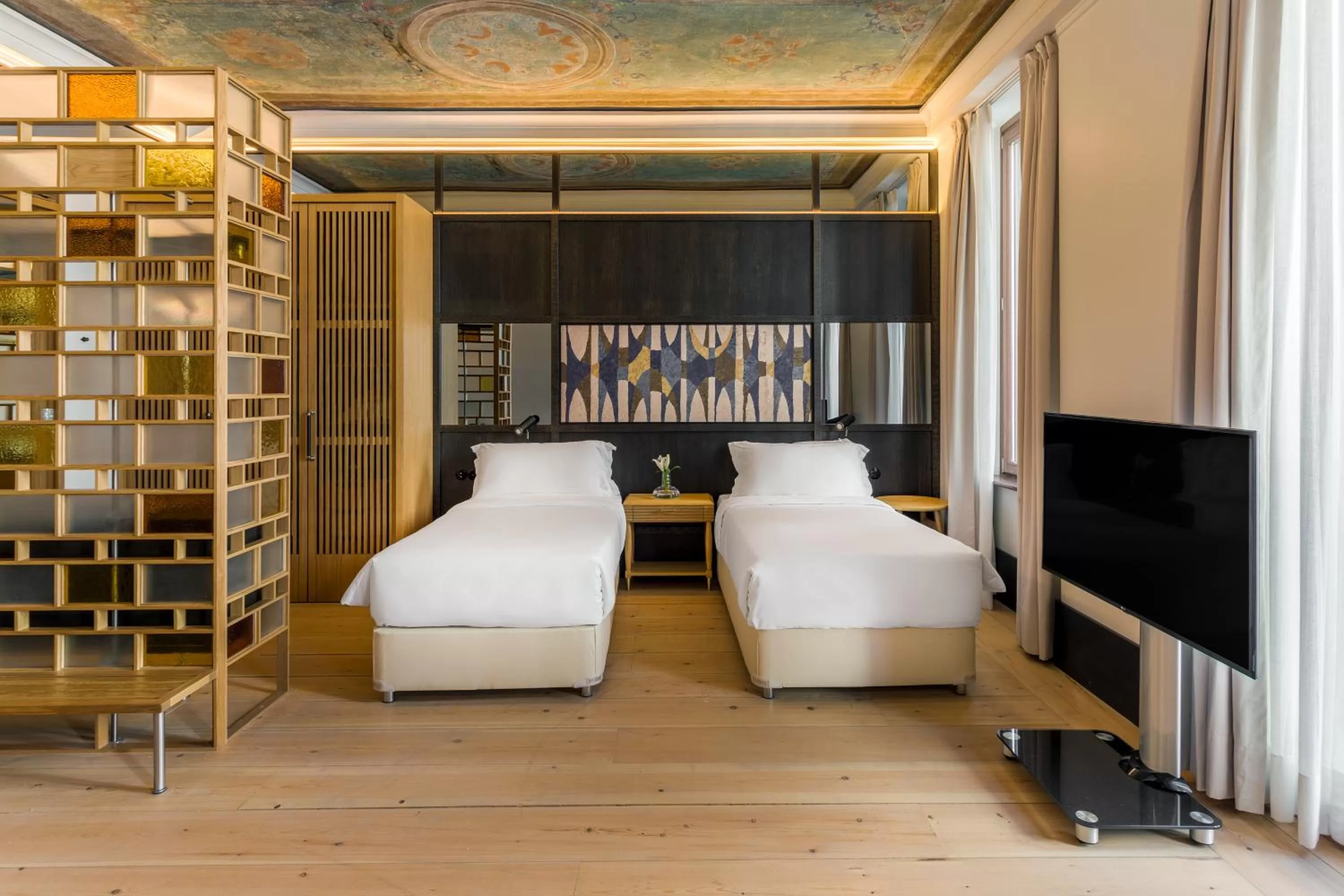 Bed in The Wings Hotels Collection