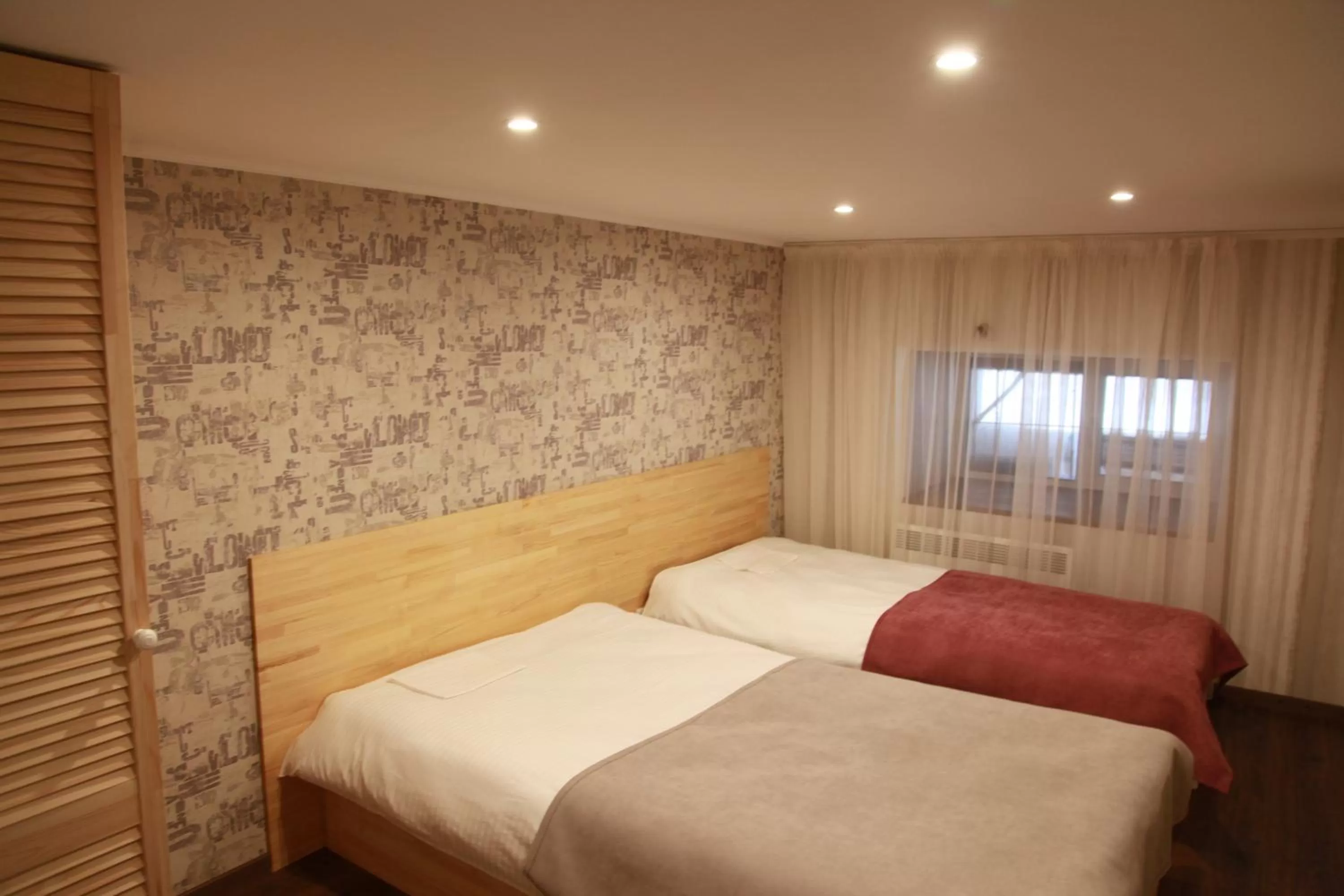 Bed in WINE & ROSE BOUTIQUE HOTEL