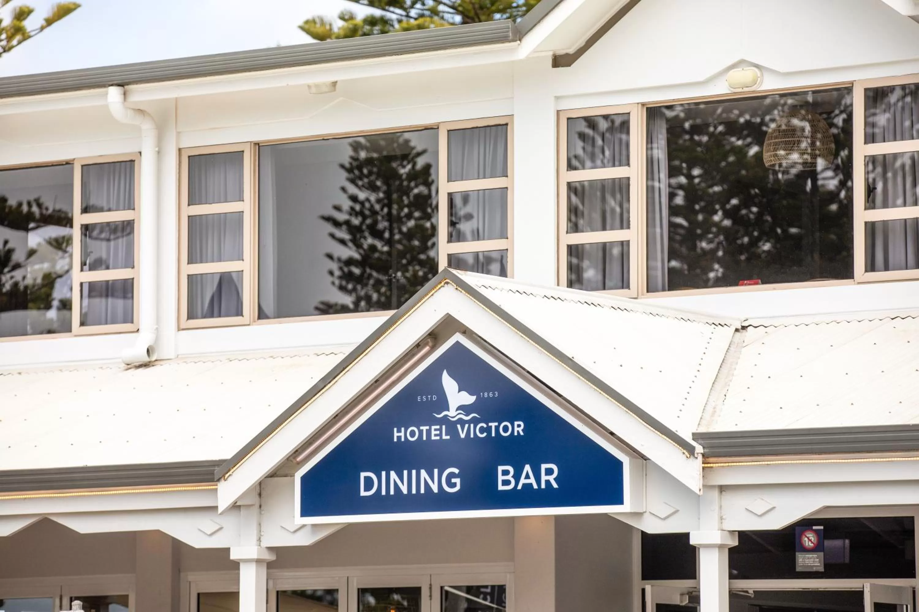 Property logo or sign in Nightcap at Hotel Victor