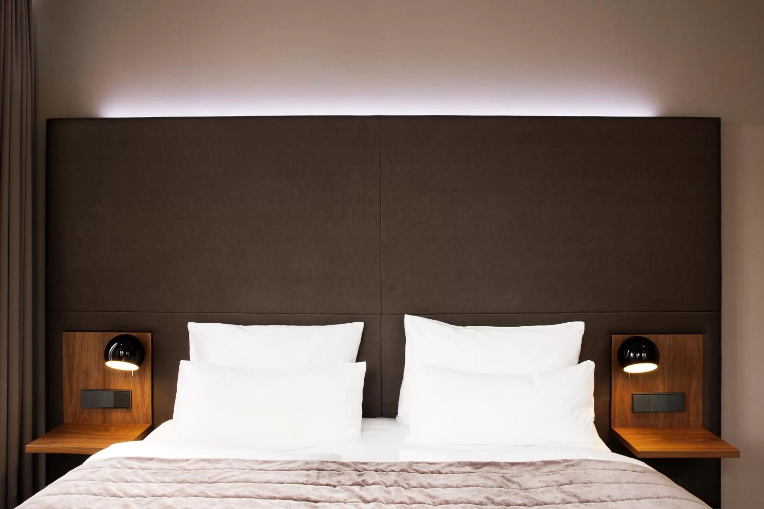 Bed in COSMO Hotel Berlin Mitte