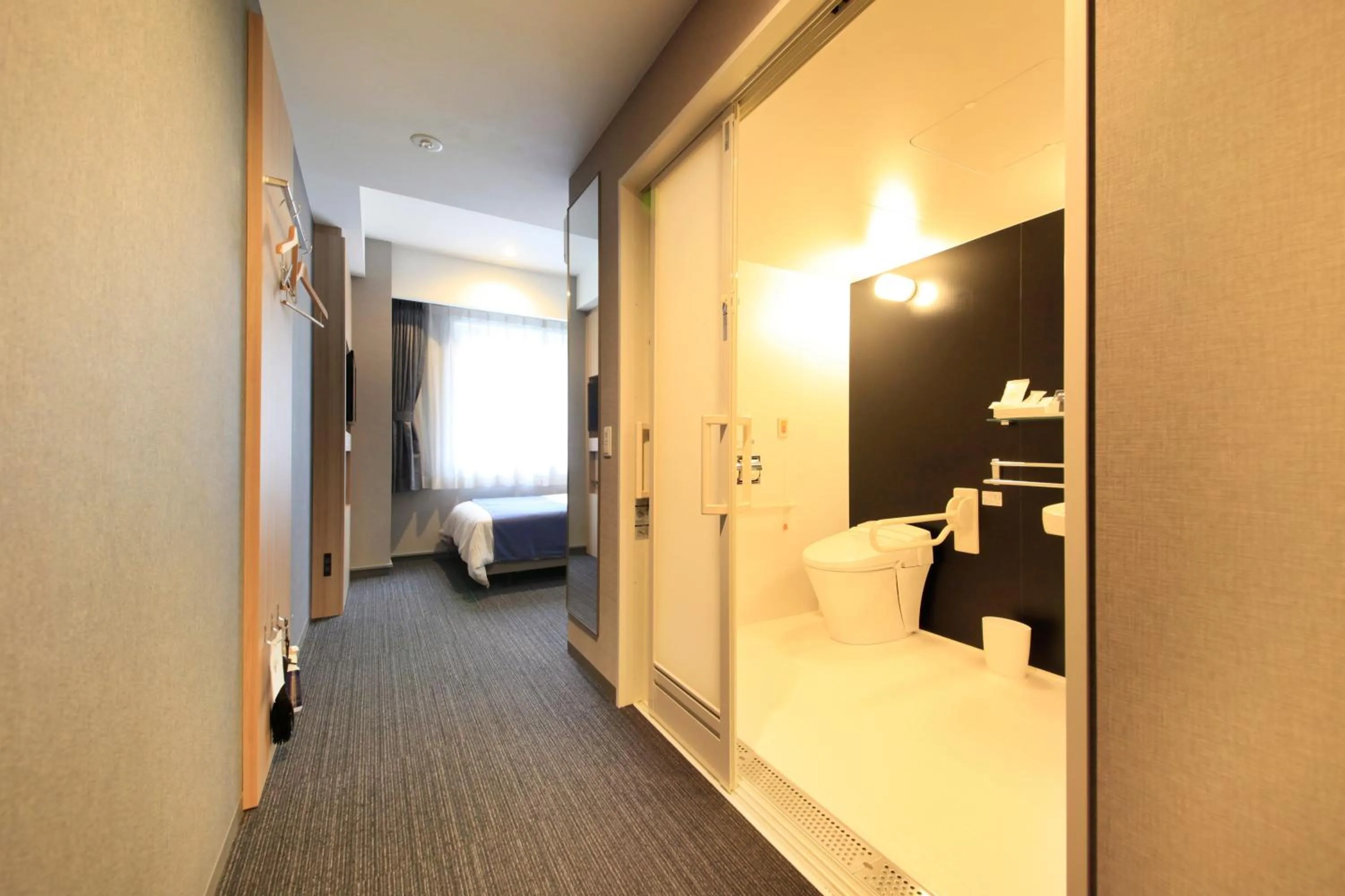 Photo of the whole room, Bed in Quintessa Hotel Osaka Shinsaibashi Comic & Books