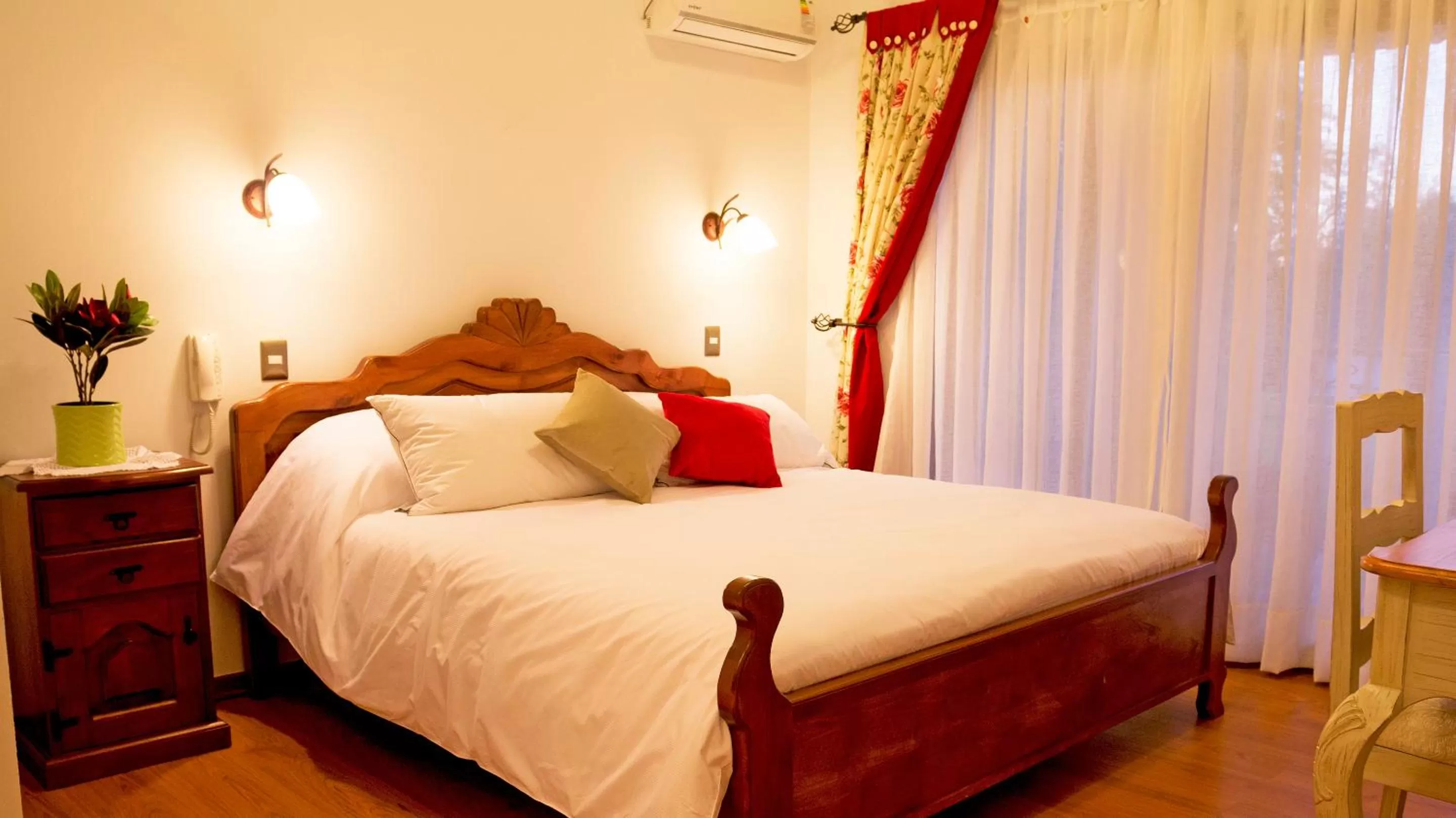 Bed in La Perla Hotel