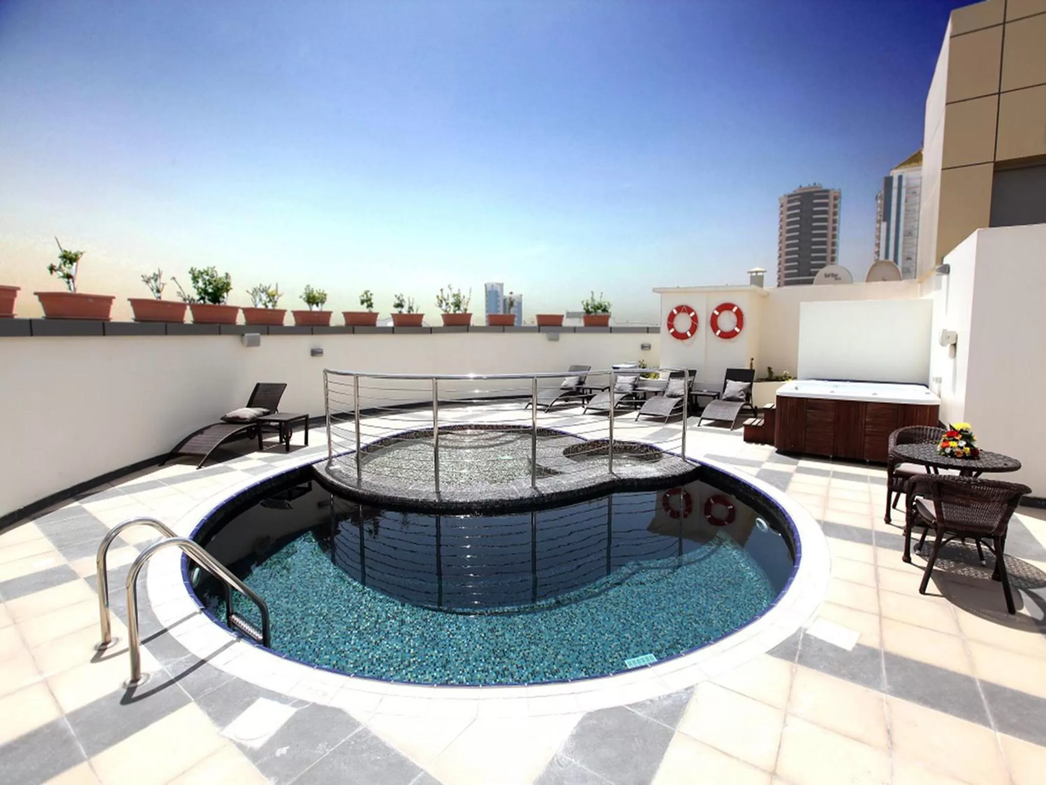 Swimming pool in Xclusive Maples Hotel Apartment