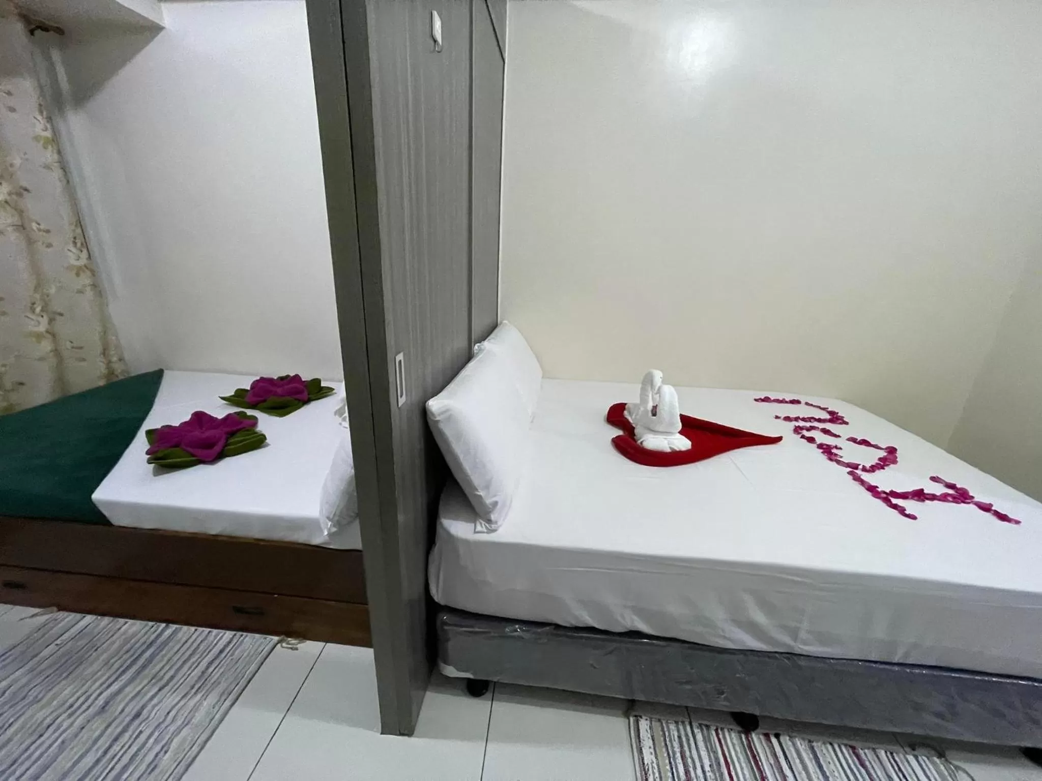 Bed in Green Residences Stays by PBYY