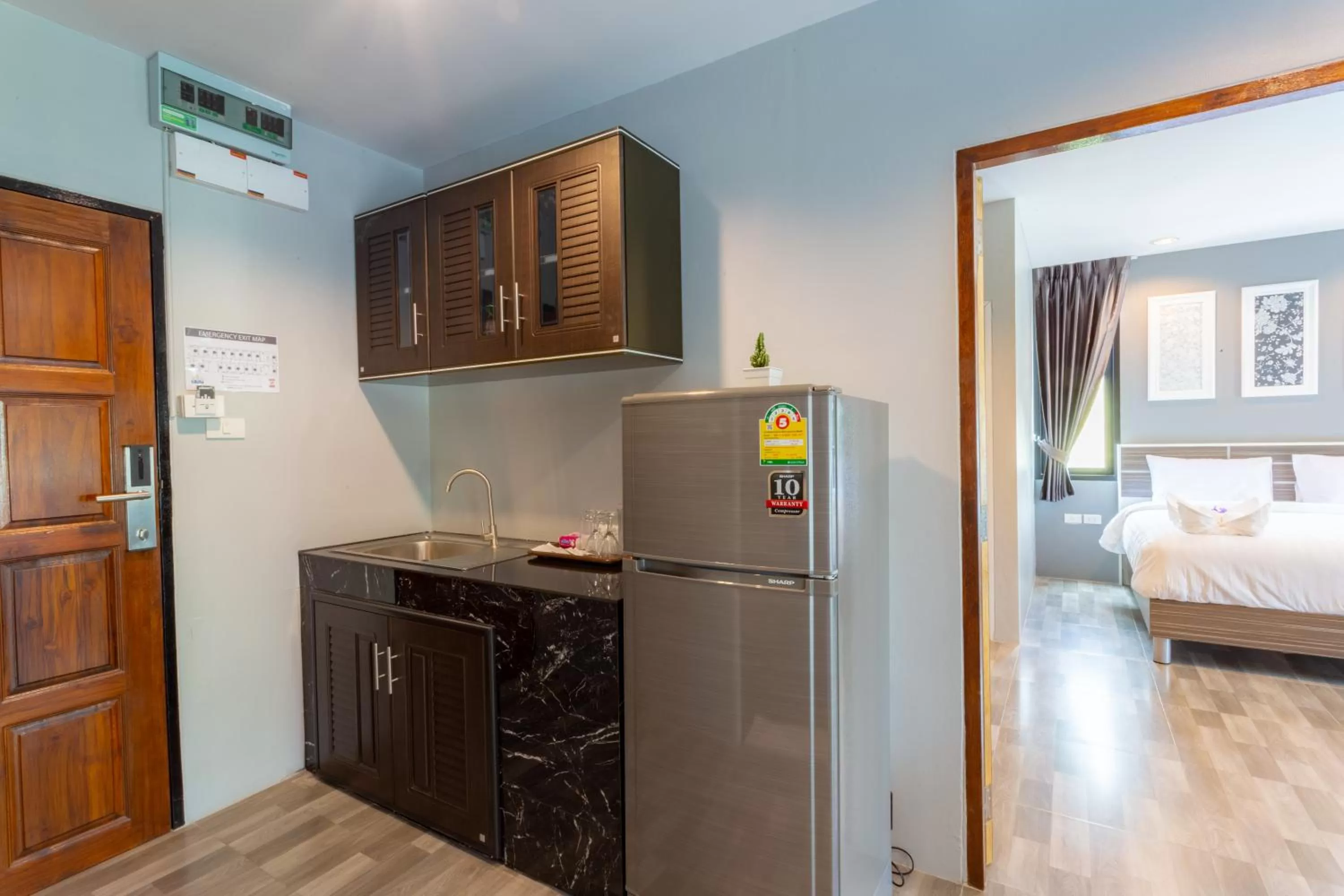 Kitchen or kitchenette, Bed in Grand Inter Hotel