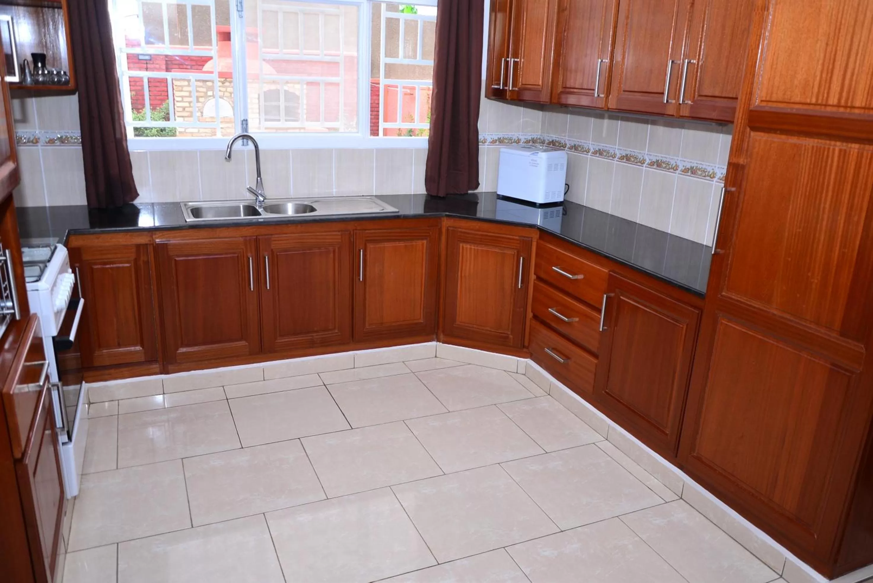 Kitchen or kitchenette in Hôtel Maisons-Sifa