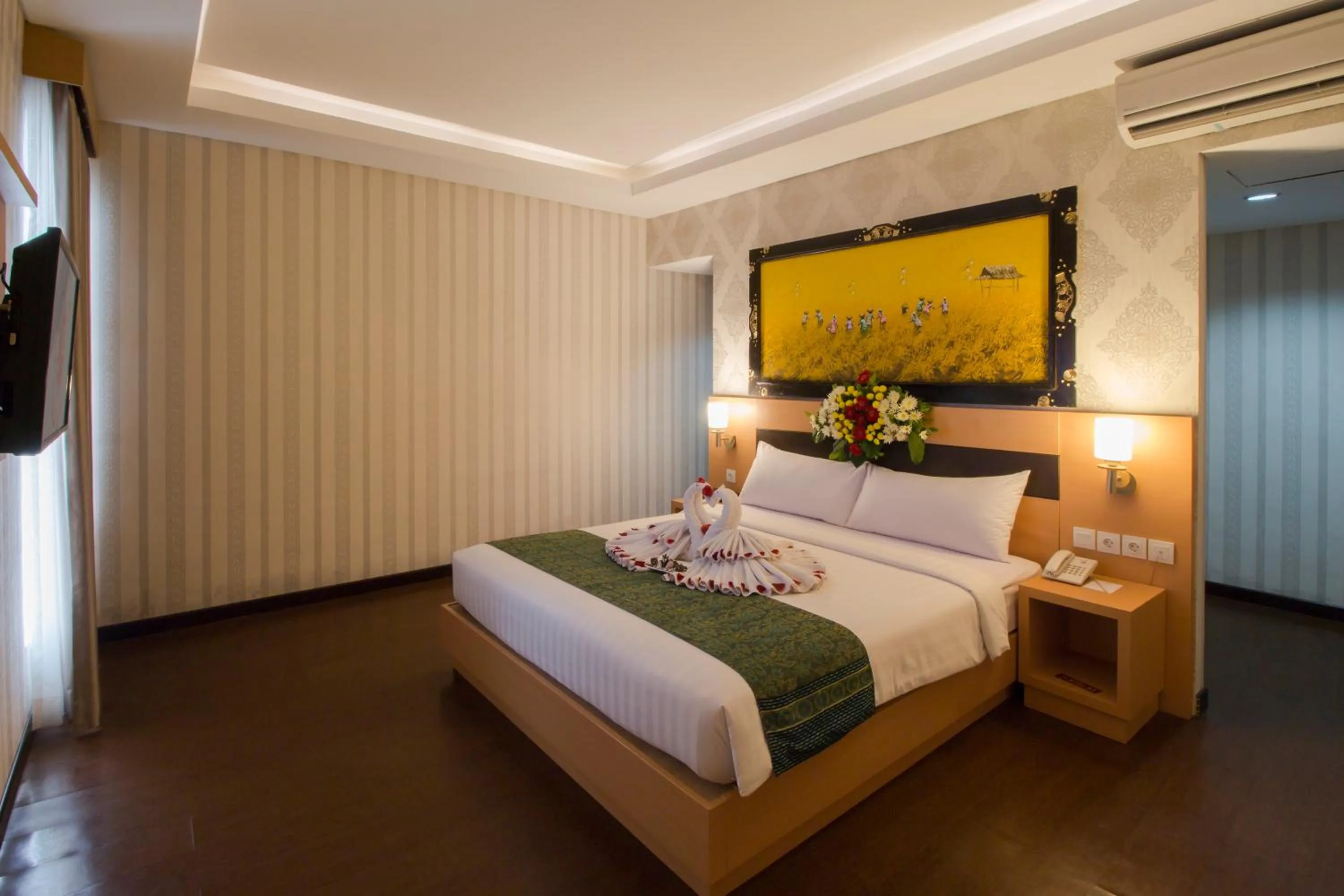 Bed in Grand Puri Saron Hotel Yogyakarta