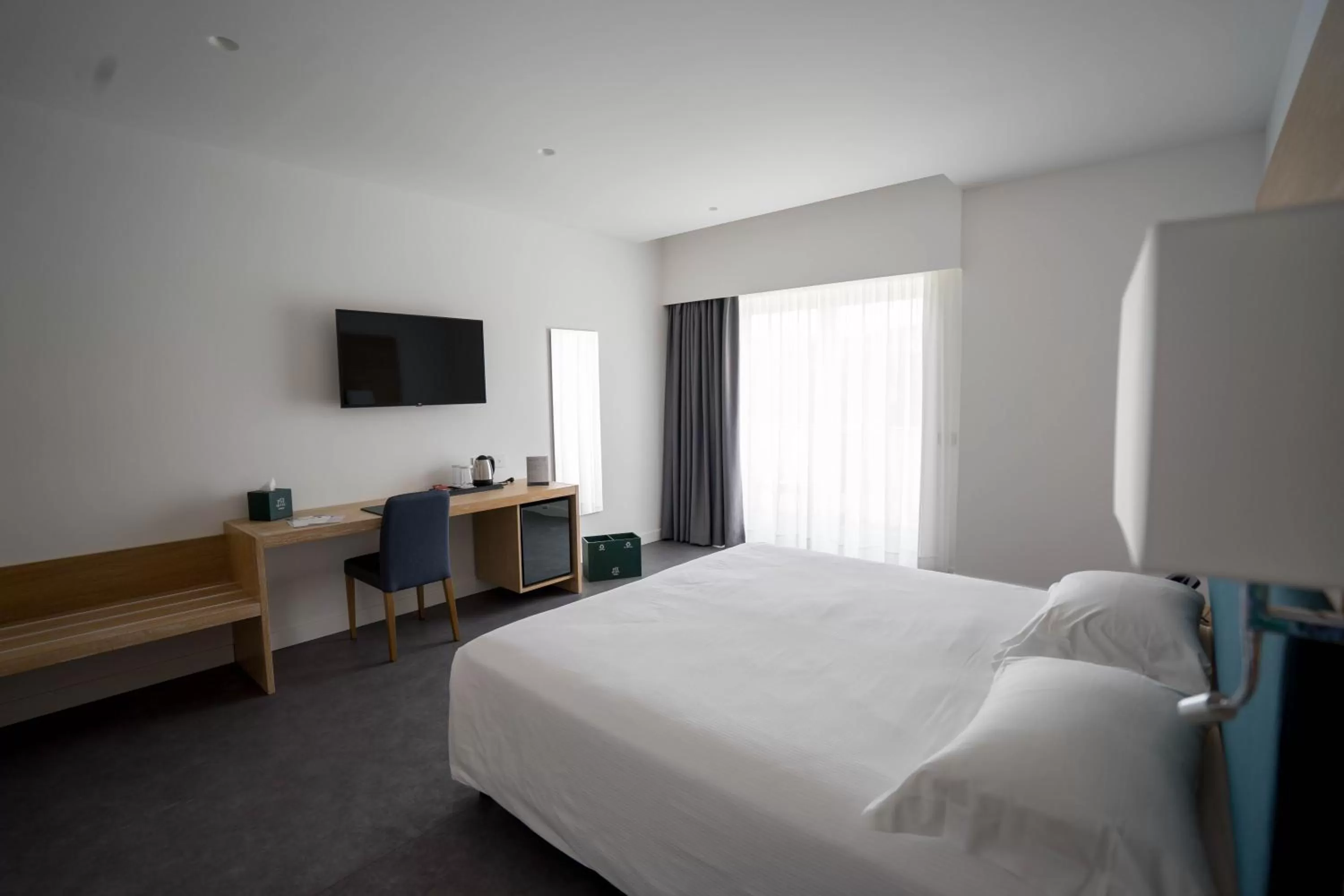 Communal lounge/ TV room, Bed in PM Hotel