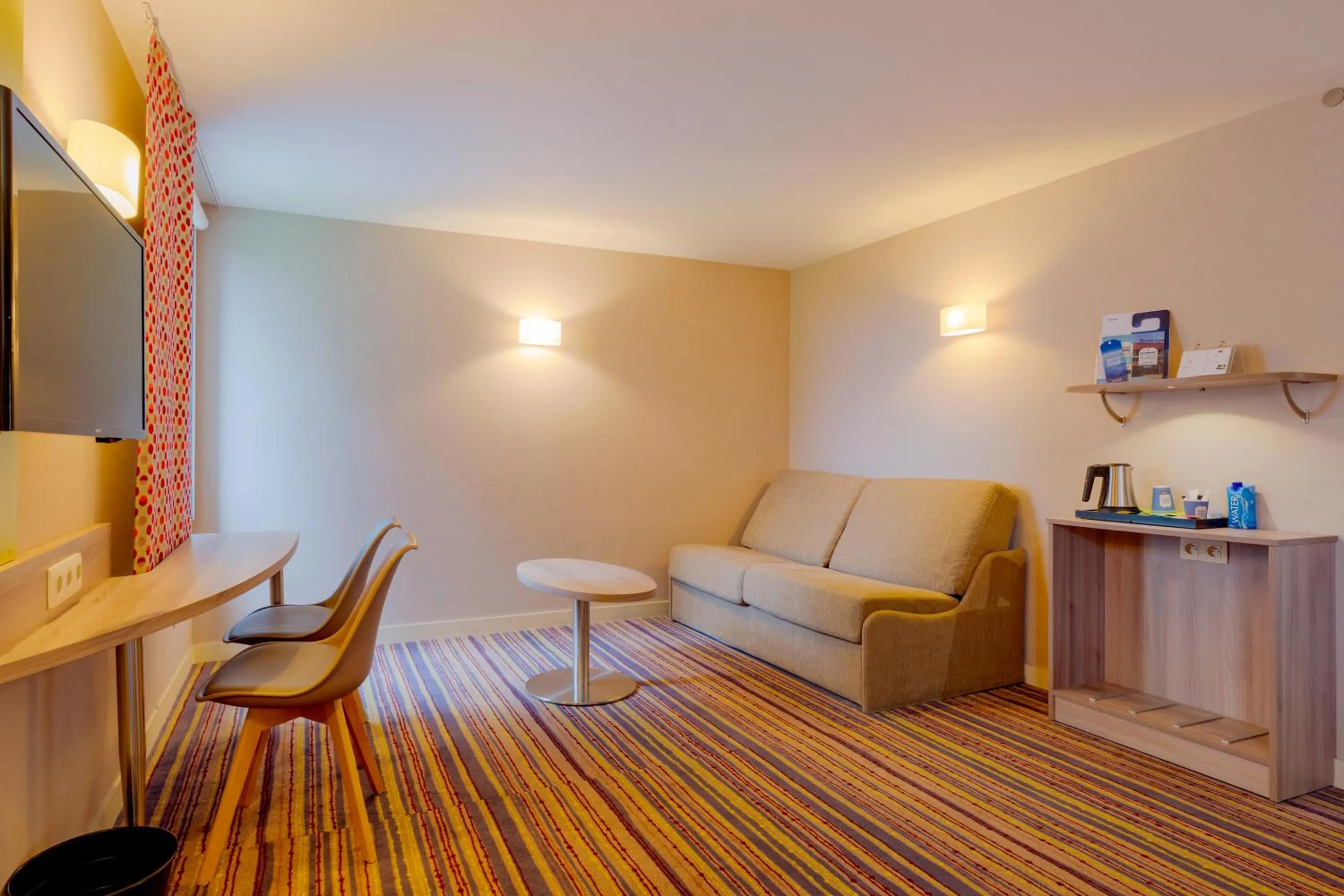 Seating area in Kyriad Lyon Est - Saint Bonnet De Mure