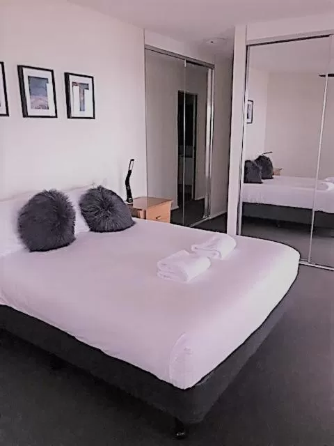 Bed in Sunrise Luxury Apartments