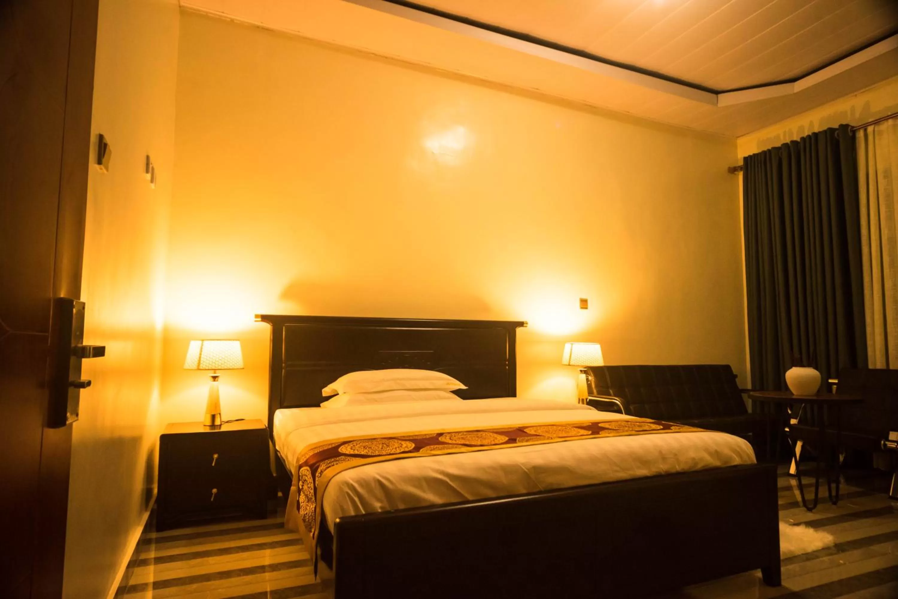 Bed in AVISHA TOWN HOTEL