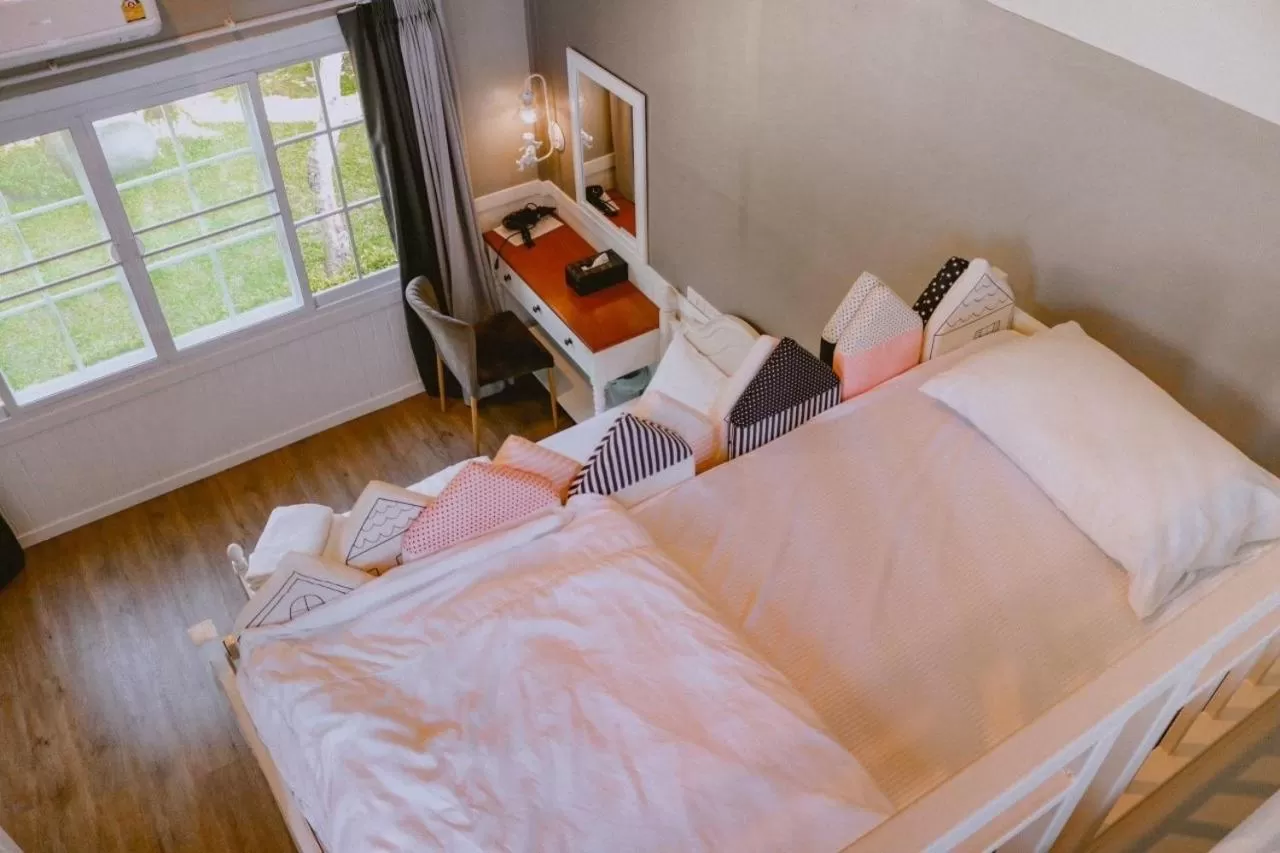 Bed in Baan JaoKorKluay บ้านเจ้ากอกล้วย