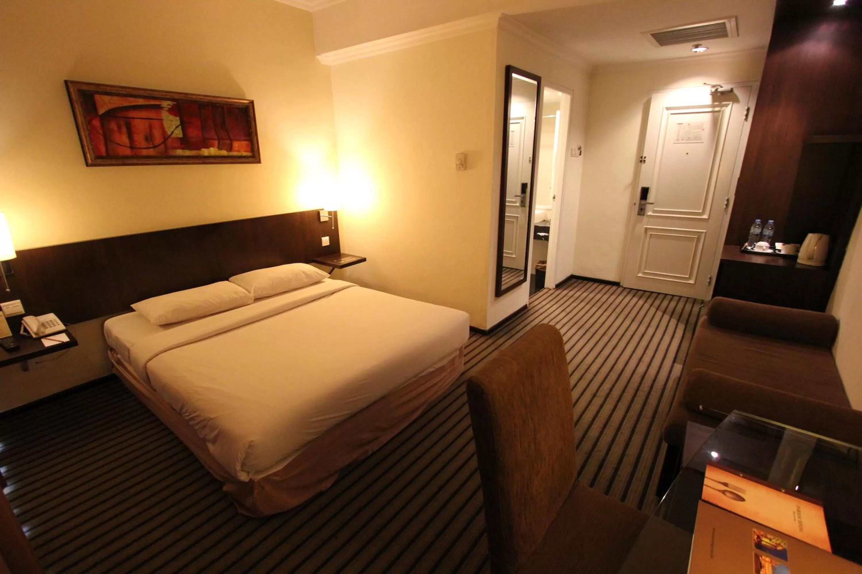 Bed in Harmoni One Convention Hotel and Service Apartments