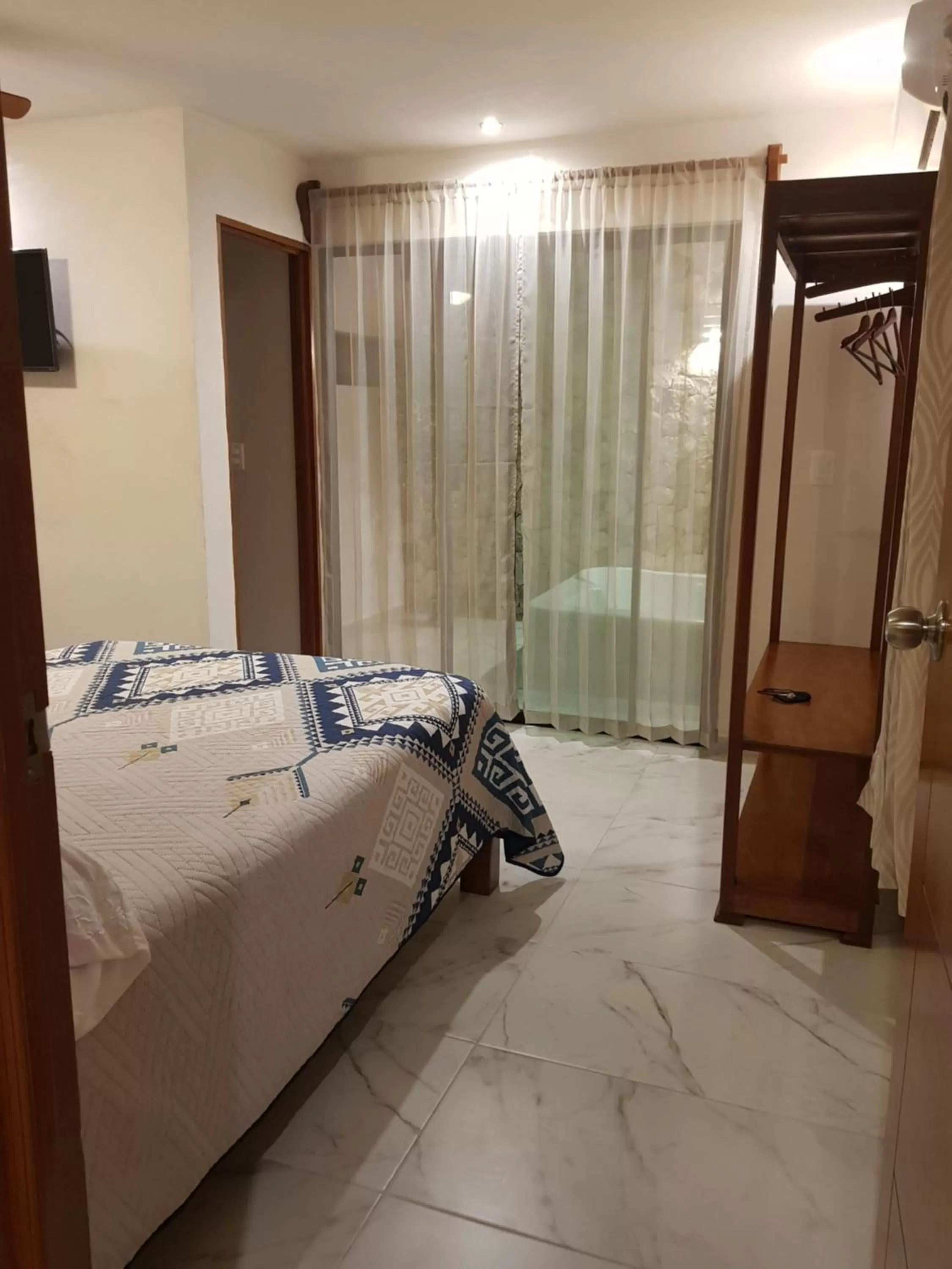 Bed in Hotel Boutique Bugambilias