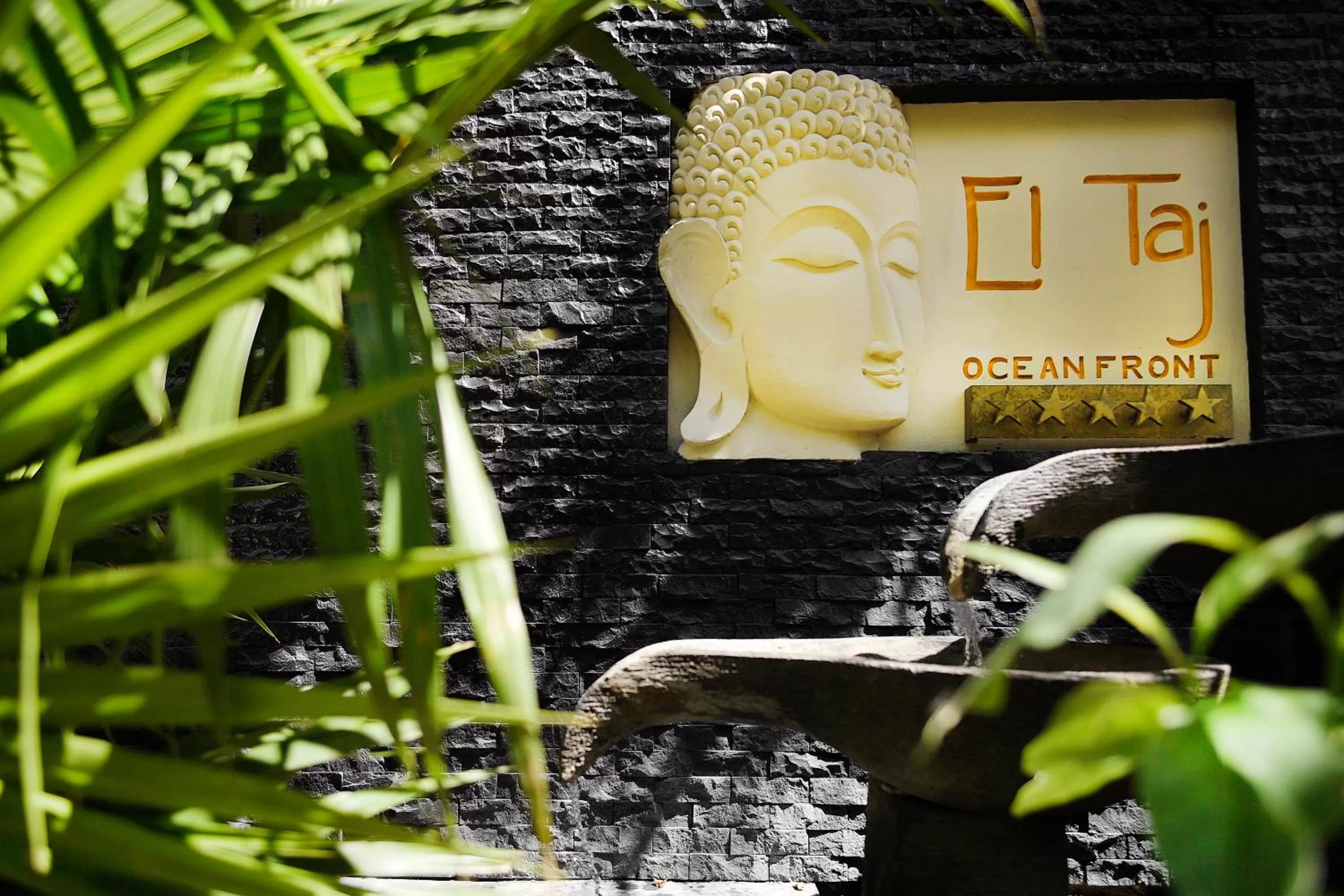 Property logo or sign in El Taj Oceanfront and Beachside Condo Hotel