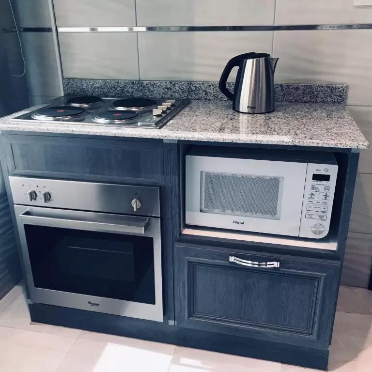 Kitchen/Kitchenette in Atlantis Suites Hotel