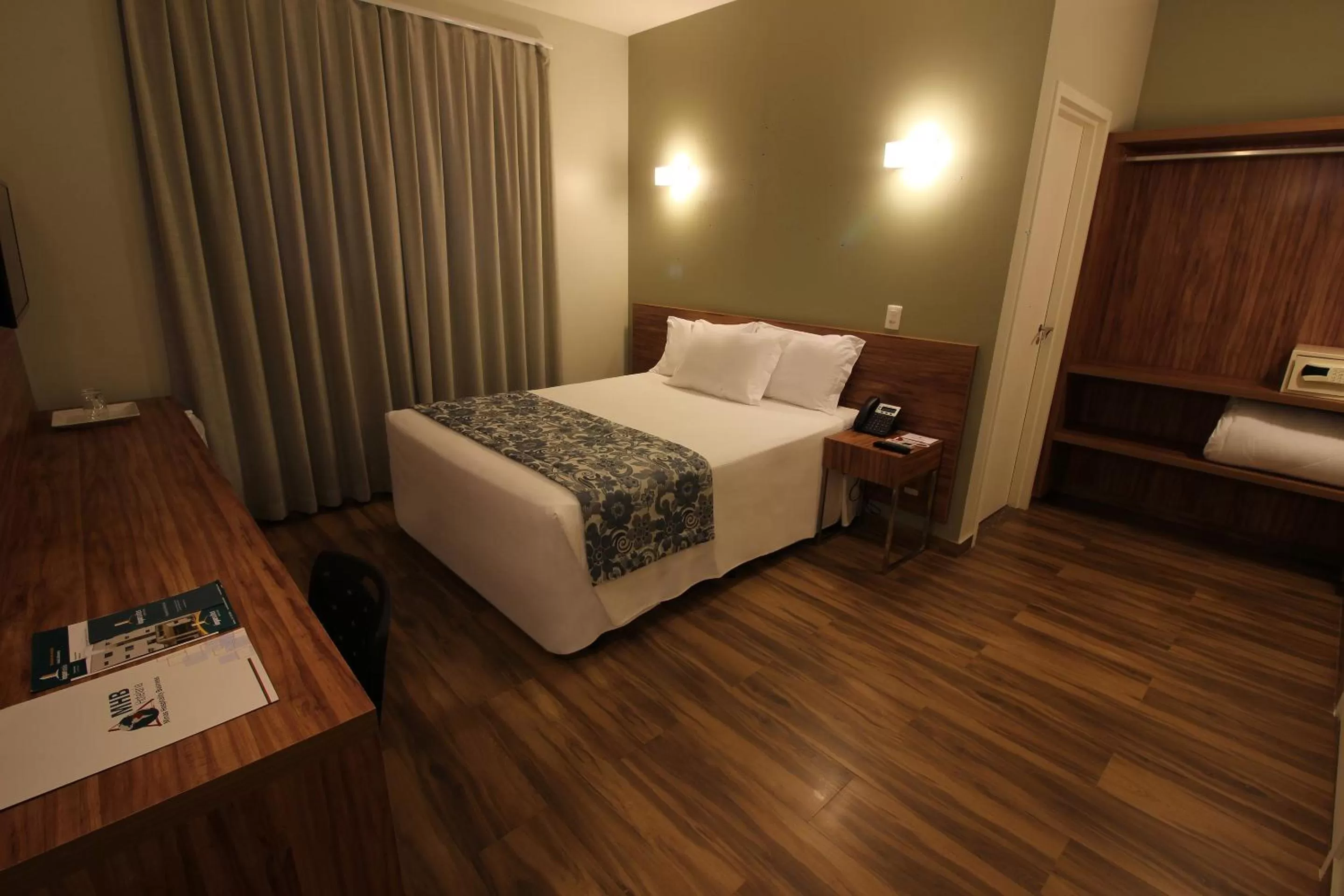 Photo of the whole room, Bed in Impar Suites Barao de Cocais