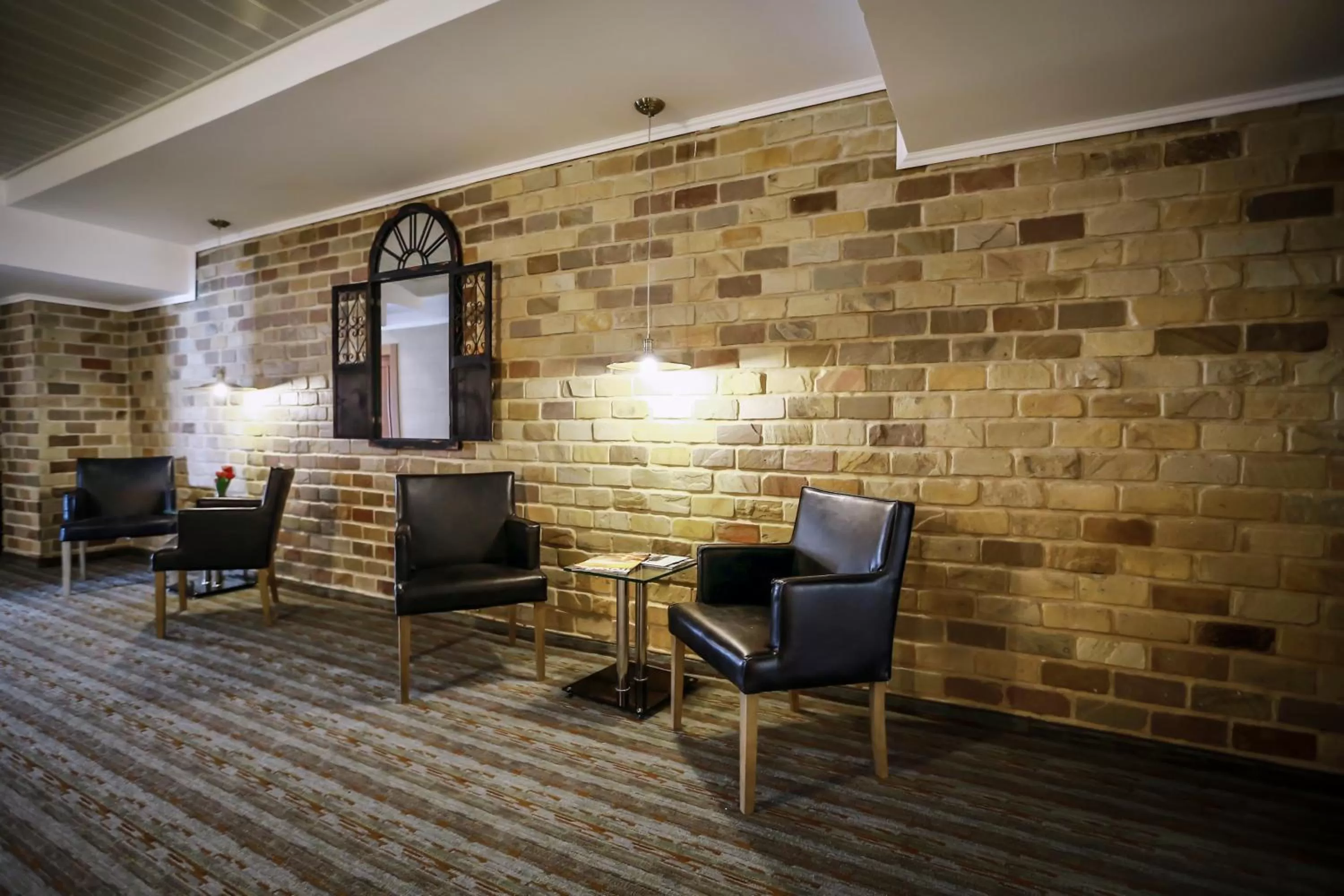 Communal lounge/ TV room in Garden Hotel Boutique & Events