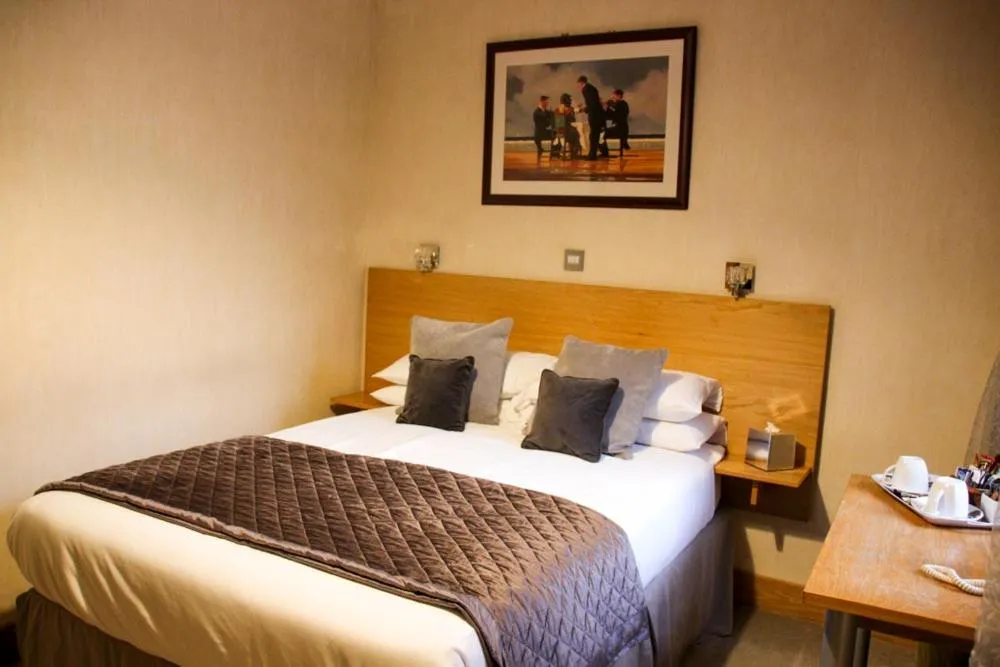 Bed in Station Hotel And Restaurant