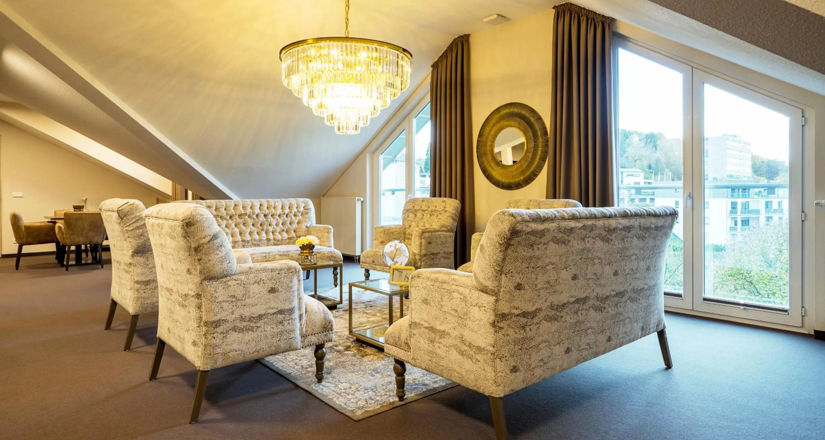 Communal lounge/ TV room in Victor's Residenz-Hotel Gummersbach