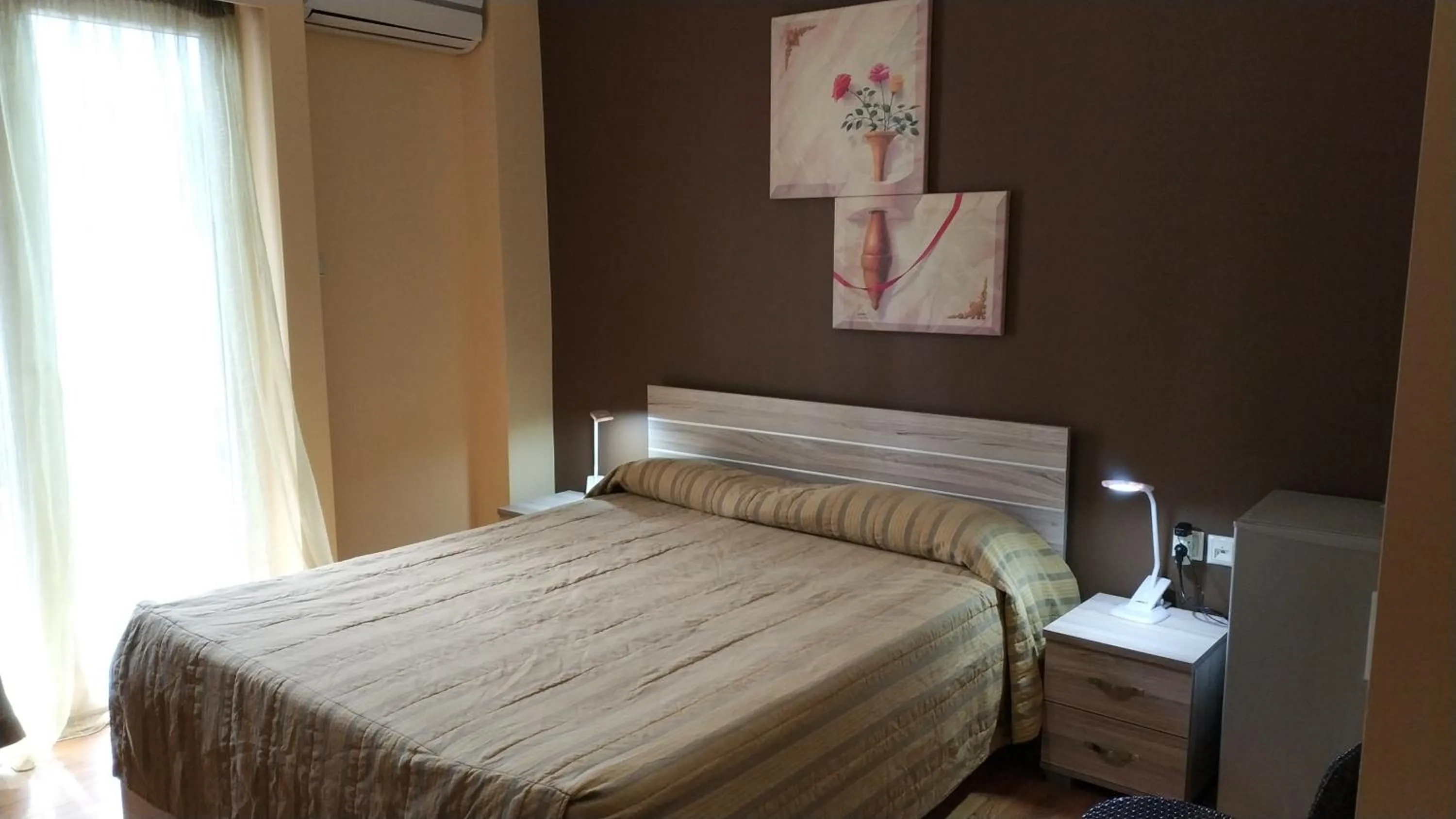 Bed in Ambrosia Suites