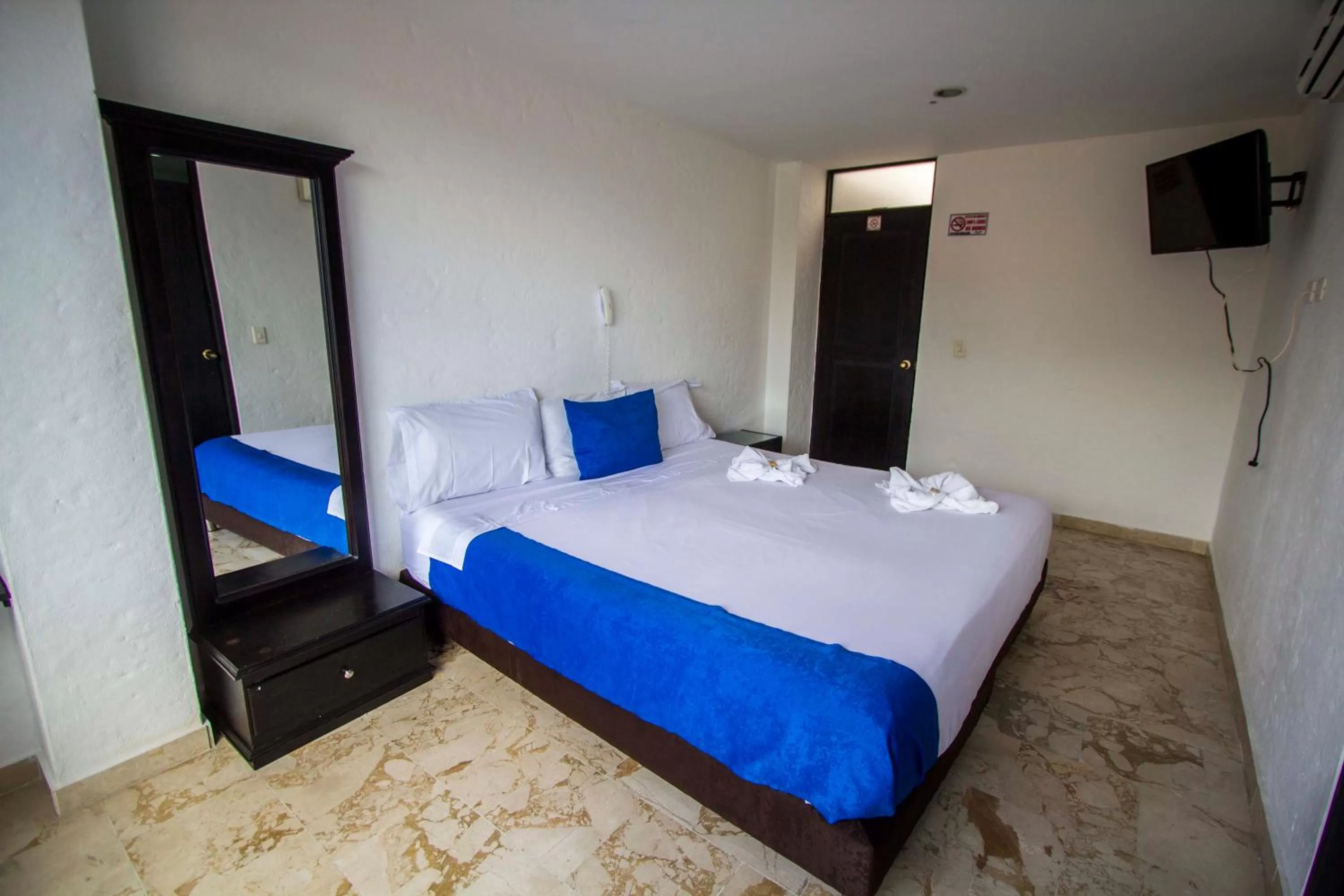 Bed in Blue Star Hotel