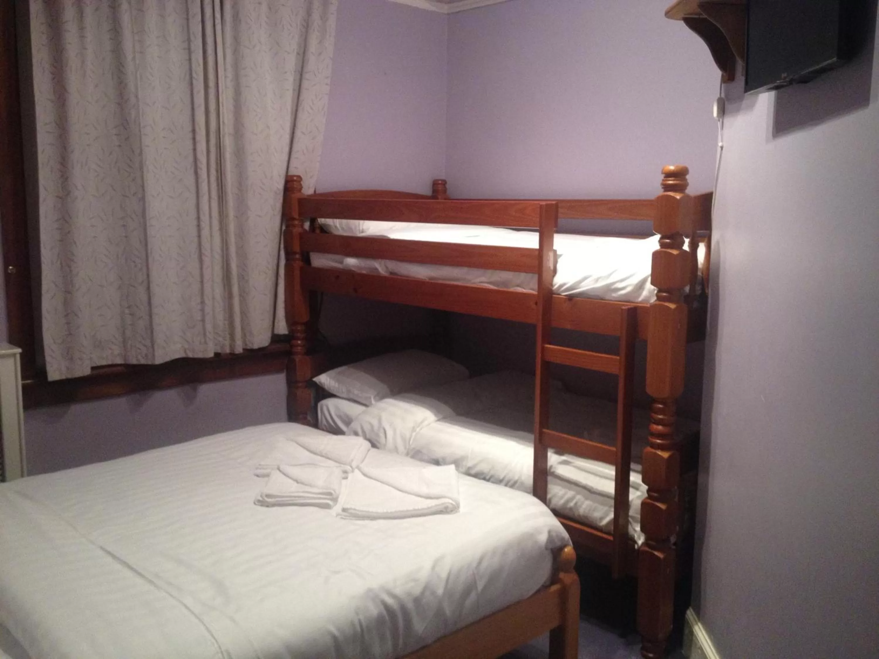 Bed in Twin Lions Hotel