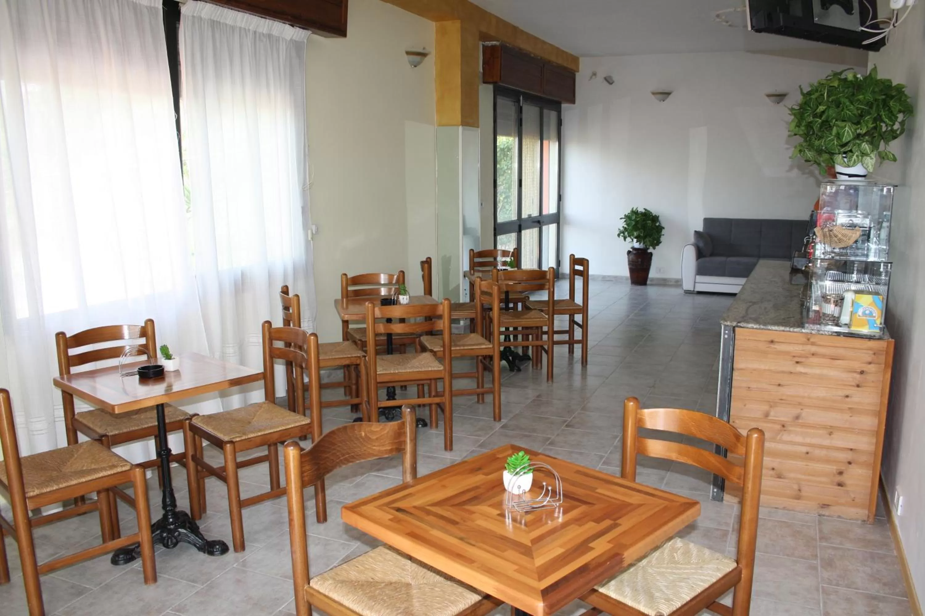 Communal lounge/ TV room in B&B Borgo Pileri