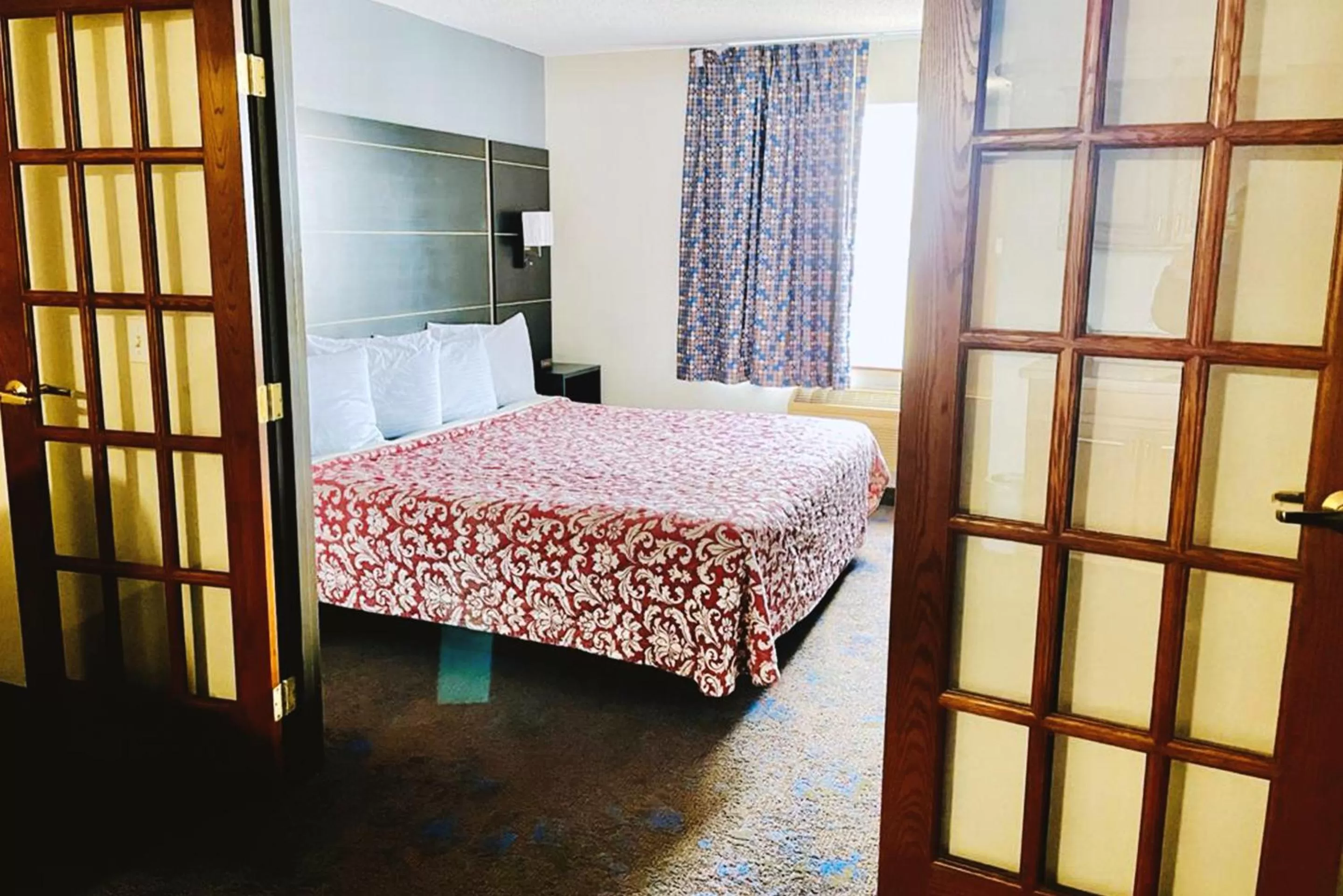 Bed in Coratel Inn & Suites by Jasper Northfield