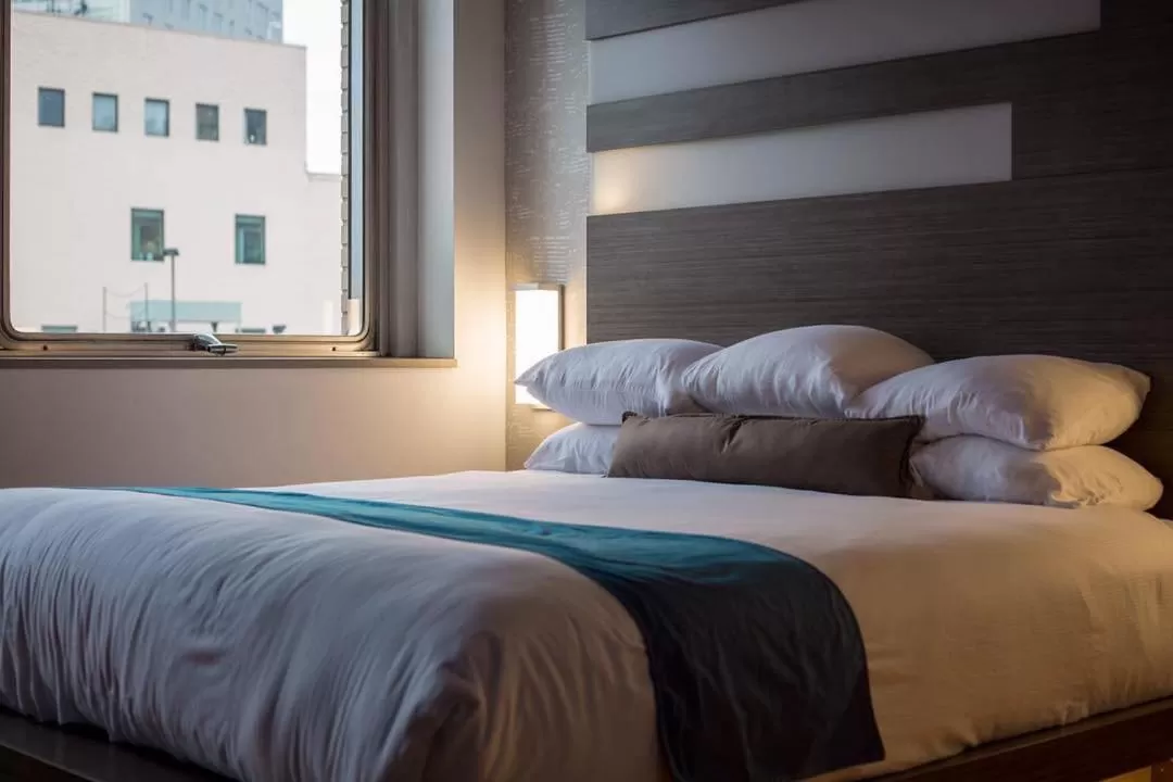 Bed in CityFlatsHotel - Grand Rapids, an Ascend Collection Hotel