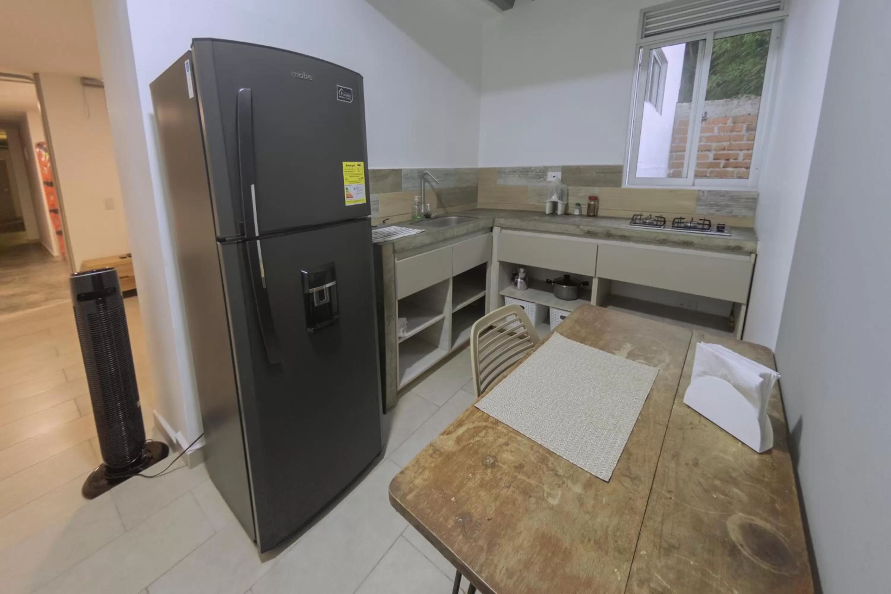 Kitchen or kitchenette, Bed in Ventiuna Hotel y Coliving