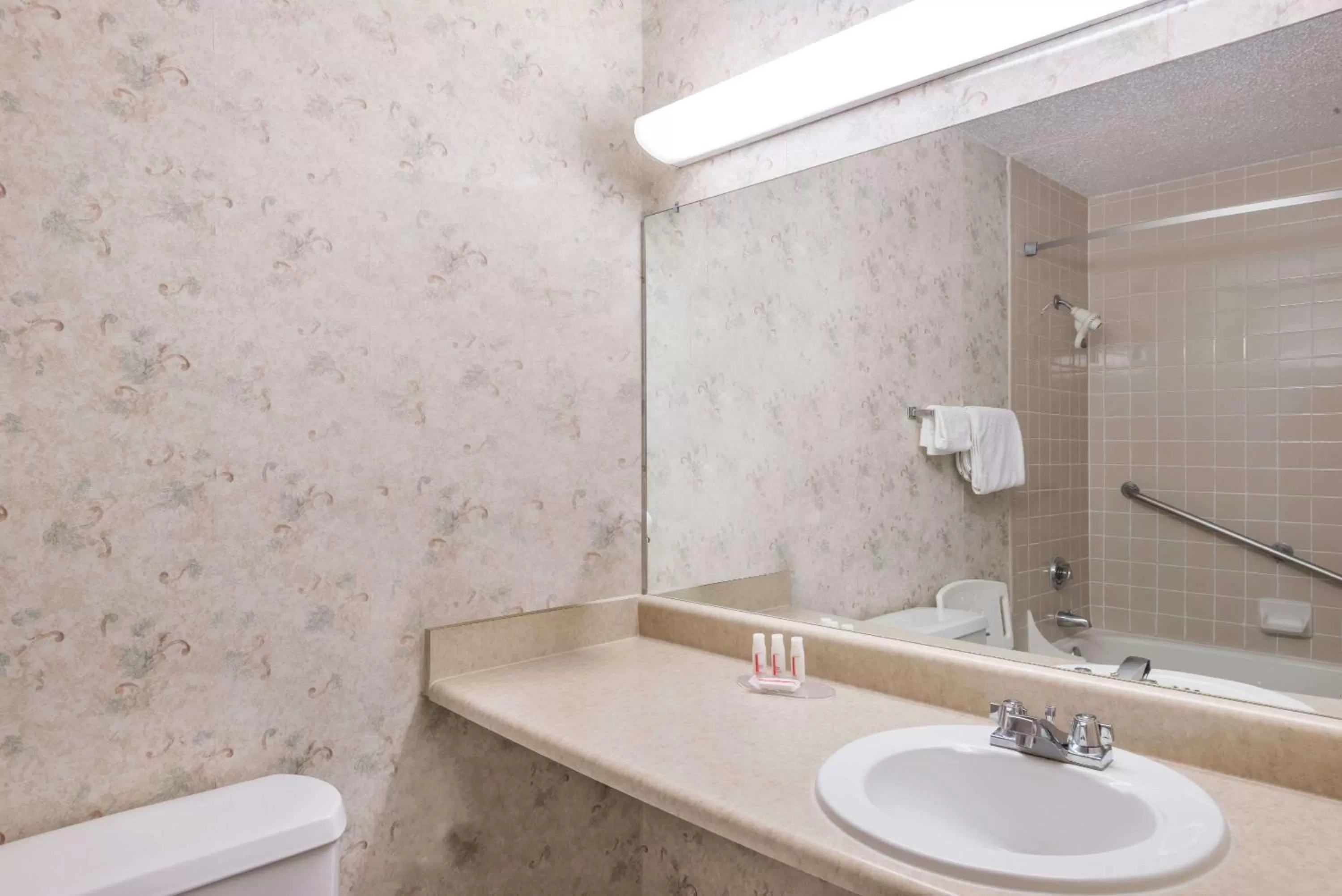 Bathroom in Ramada by Wyndham Watertown Thousand