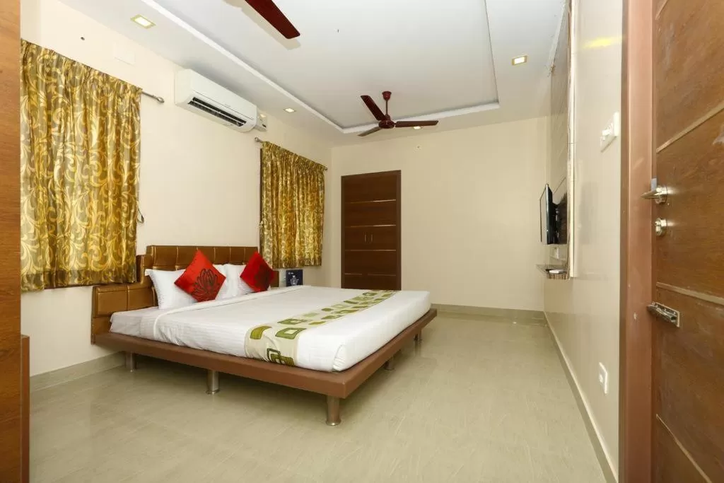 Photo of the whole room, Bed in Sri Kamadhenu Residency