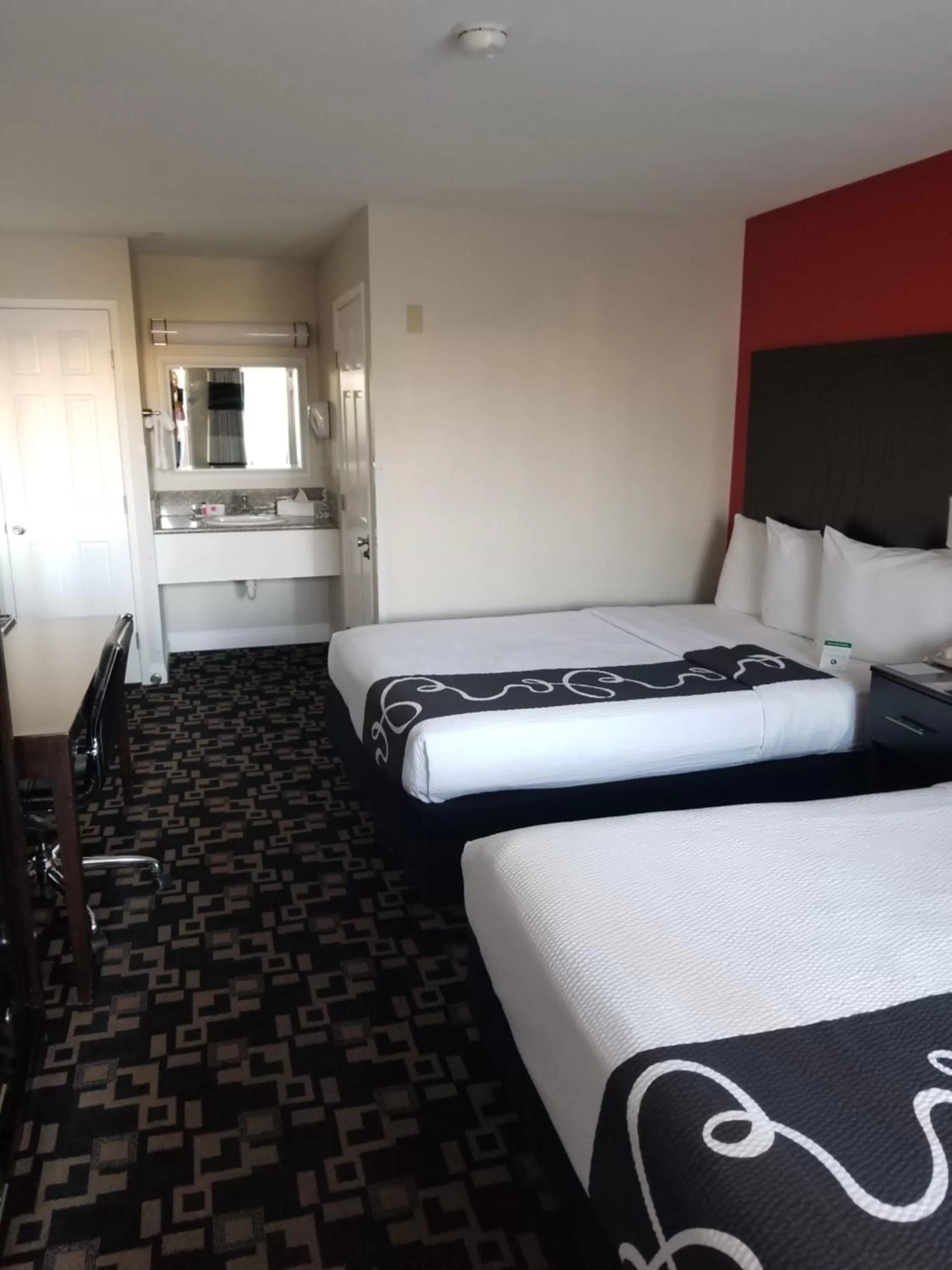 Bed in Ramada by Wyndham Oceanside