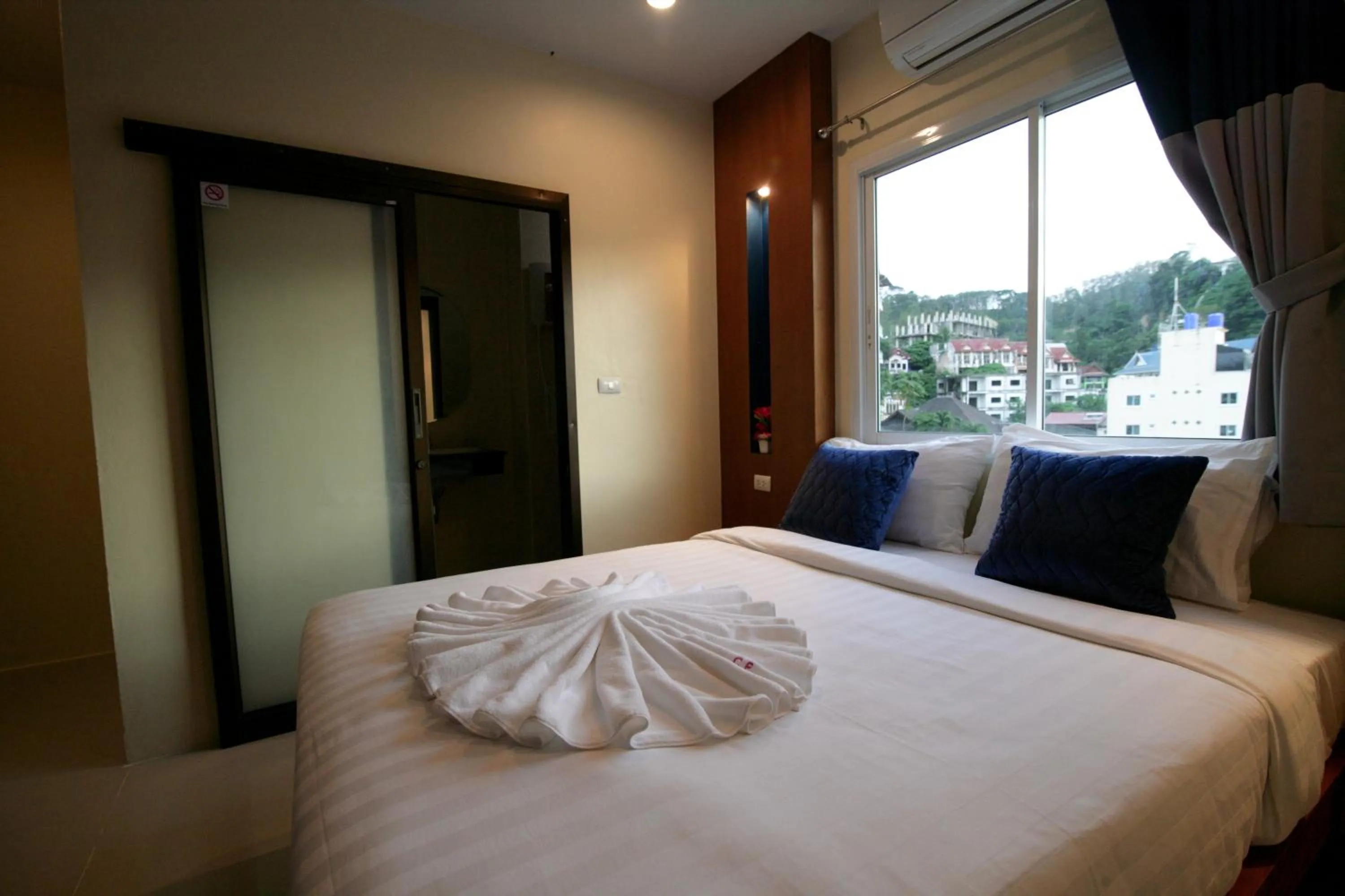 Bed in Calypso Patong Hotel