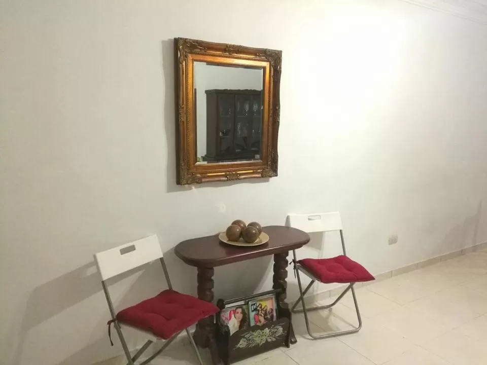 Communal lounge/ TV room in Posada Dilia del Alba