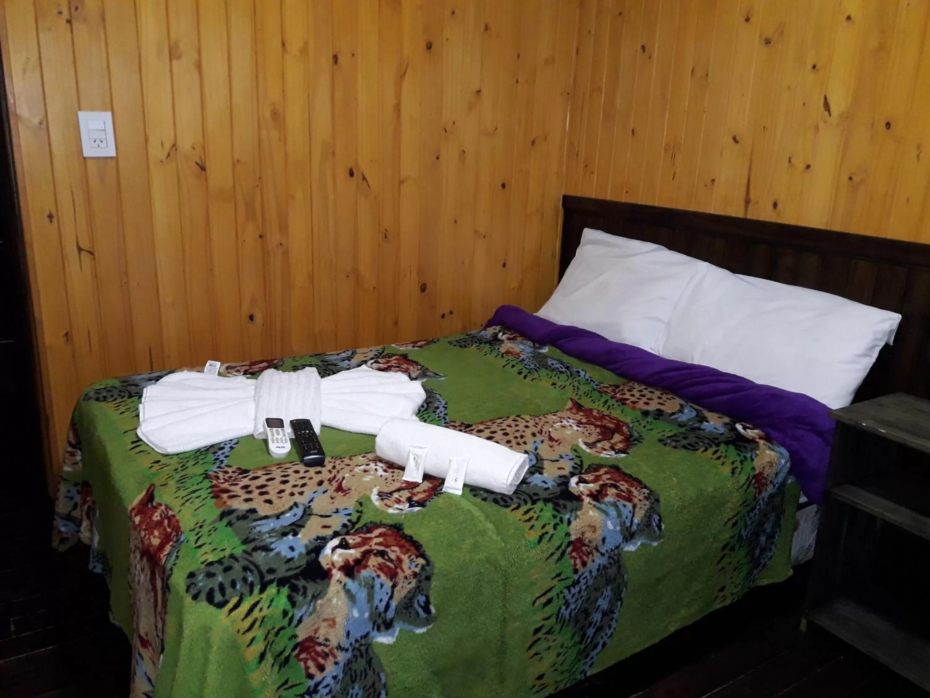 Bed in Petit Hotel Caraguata