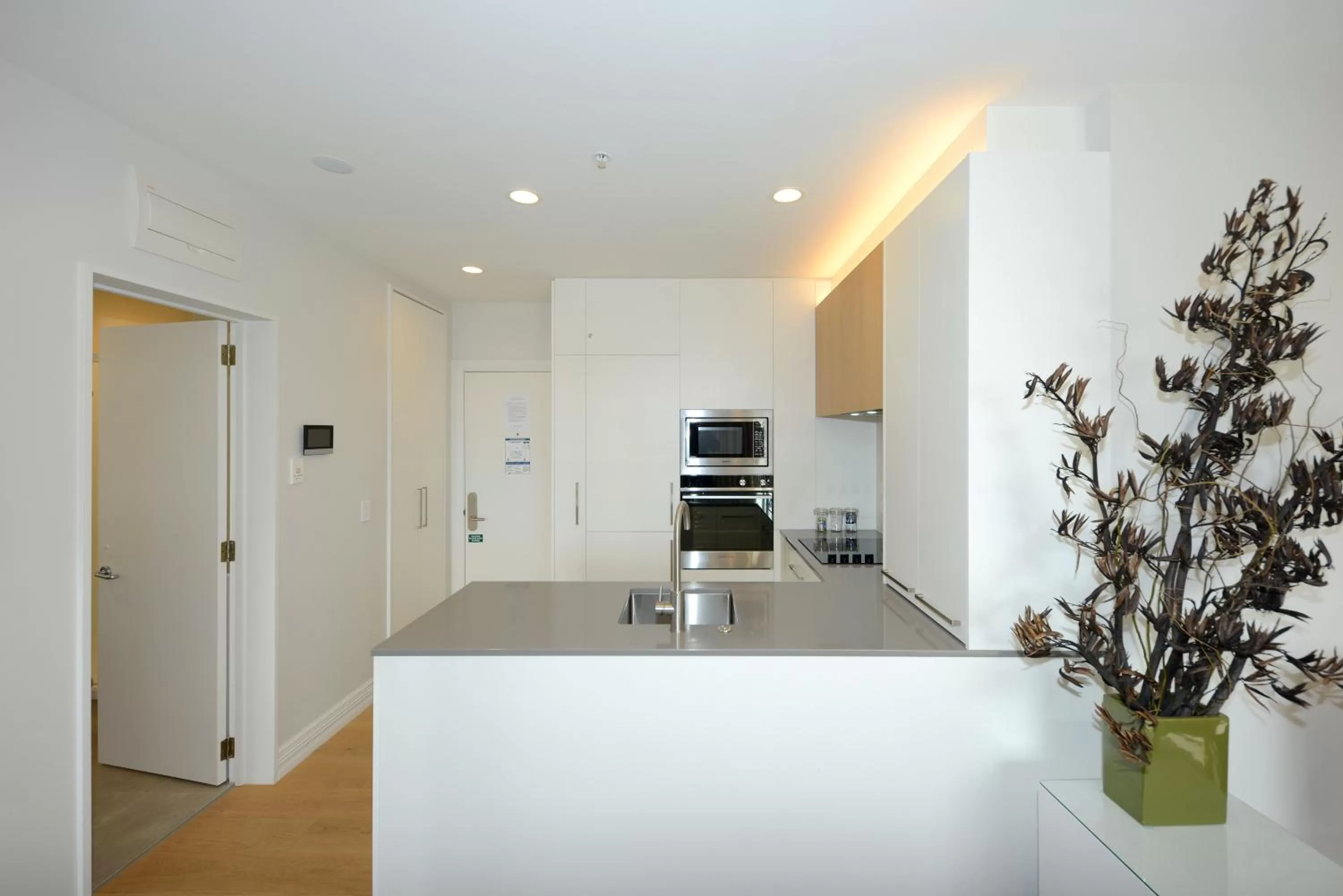 Kitchen or kitchenette in West Fitzroy Apartments