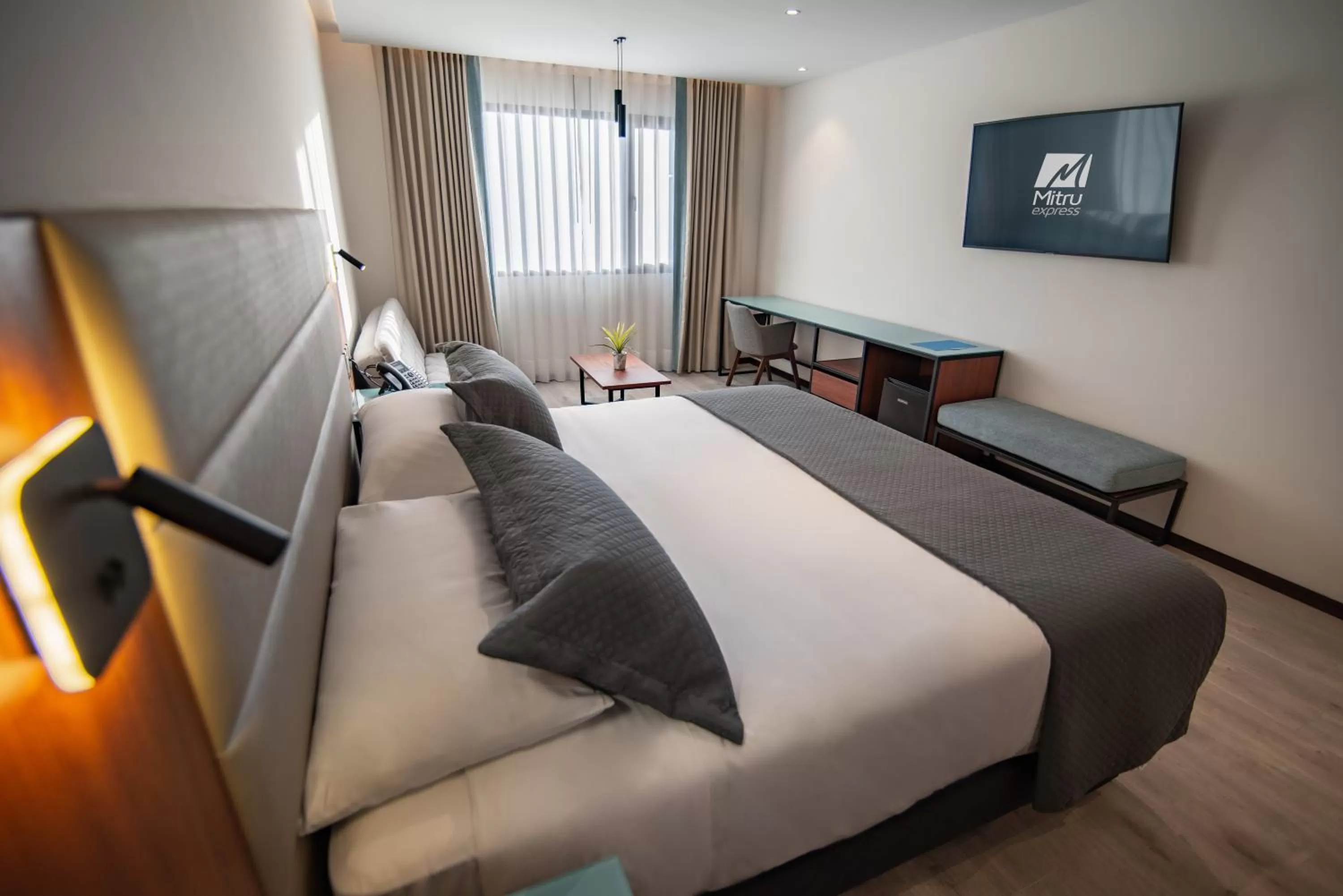 Bed in Mitru Express Hotel