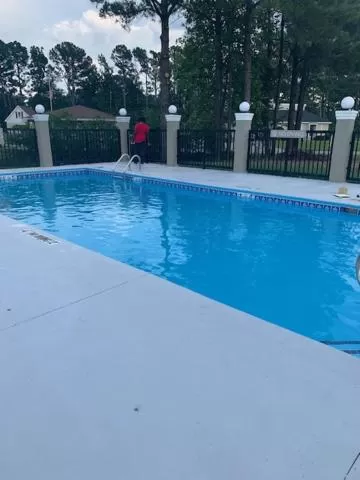 Swimming pool in Microtel Inn & Suites by Wyndham Camp Lejeune/Jacksonville