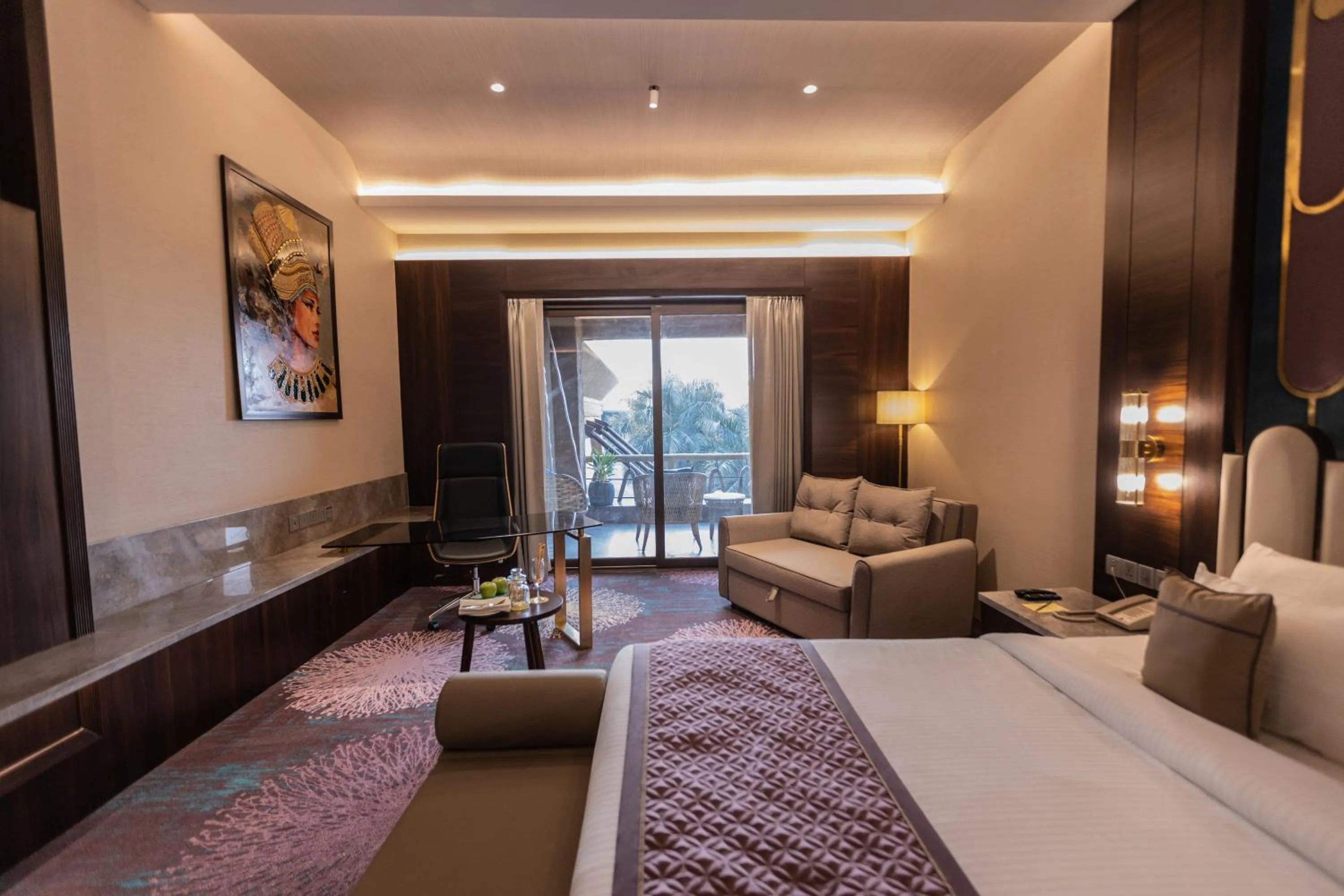 Seating area, Bed in The Corinthians Resort